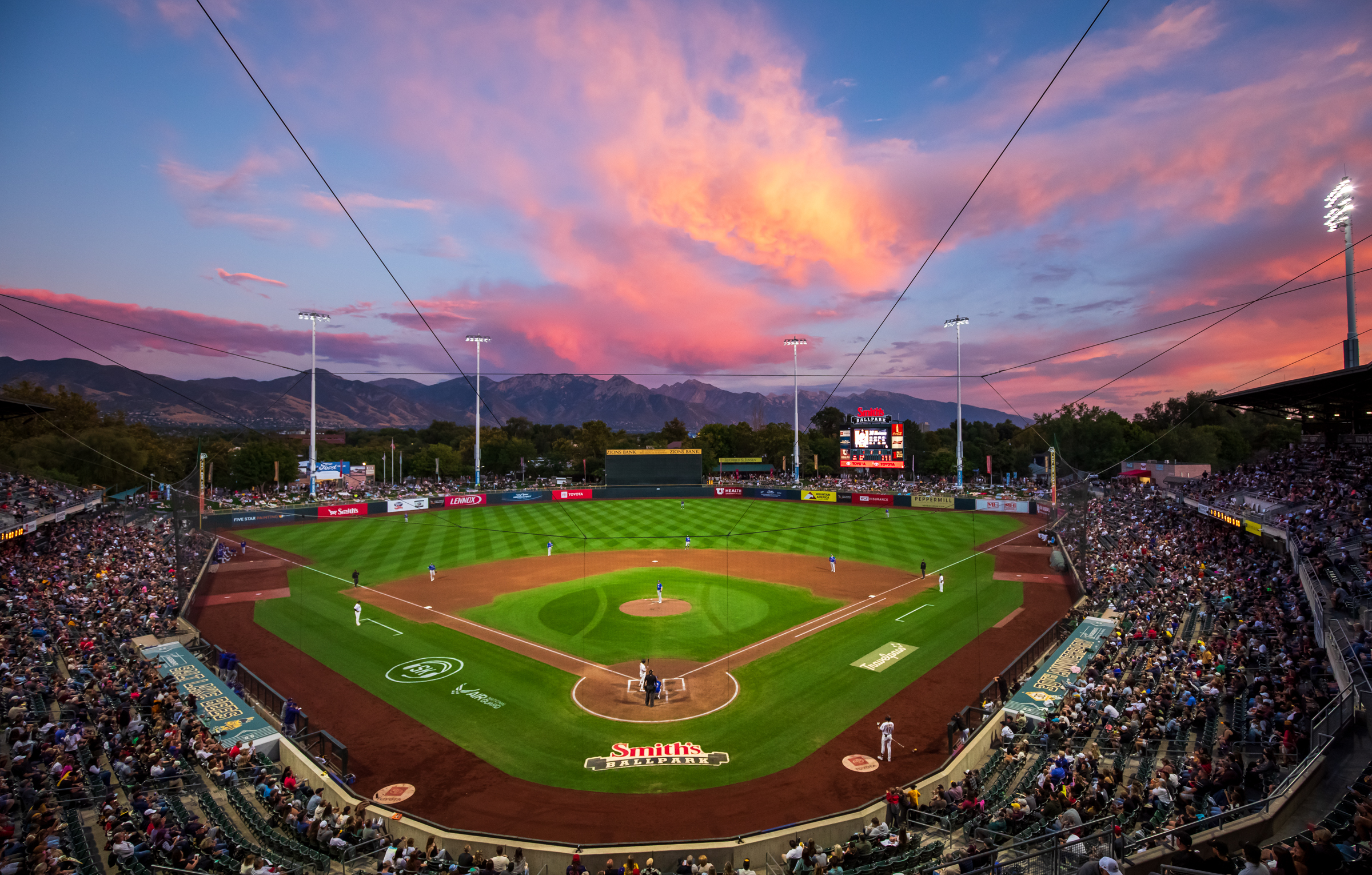 The sun sets over Smith's Ballpark while the Salt Lake Bees and Oklahoma City Baseball Club during the team's final evening game on Saturday.
