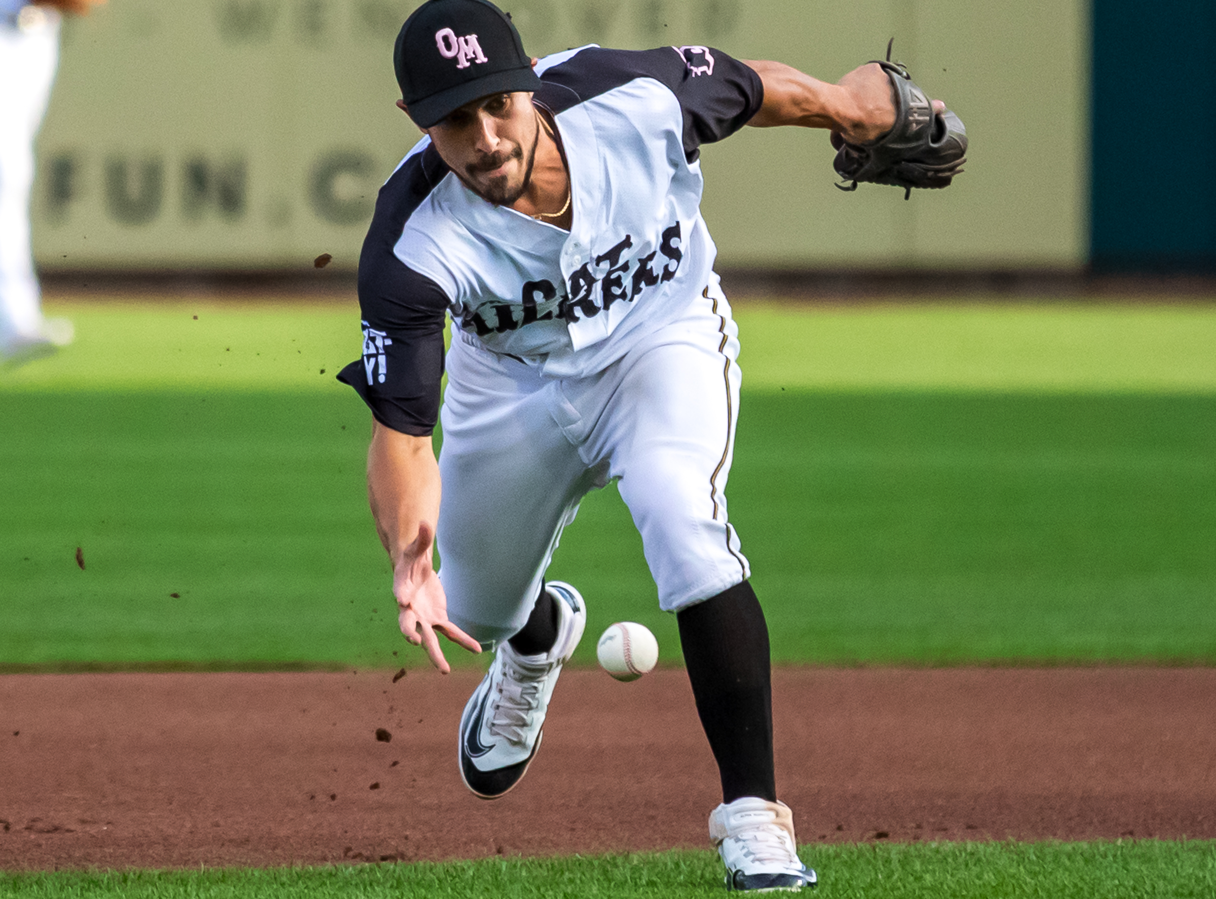 Salt Lake Bees infielder Elliot Soto attempts to make a barehanded grab during the team's game against Sacramento on Sept. 2.