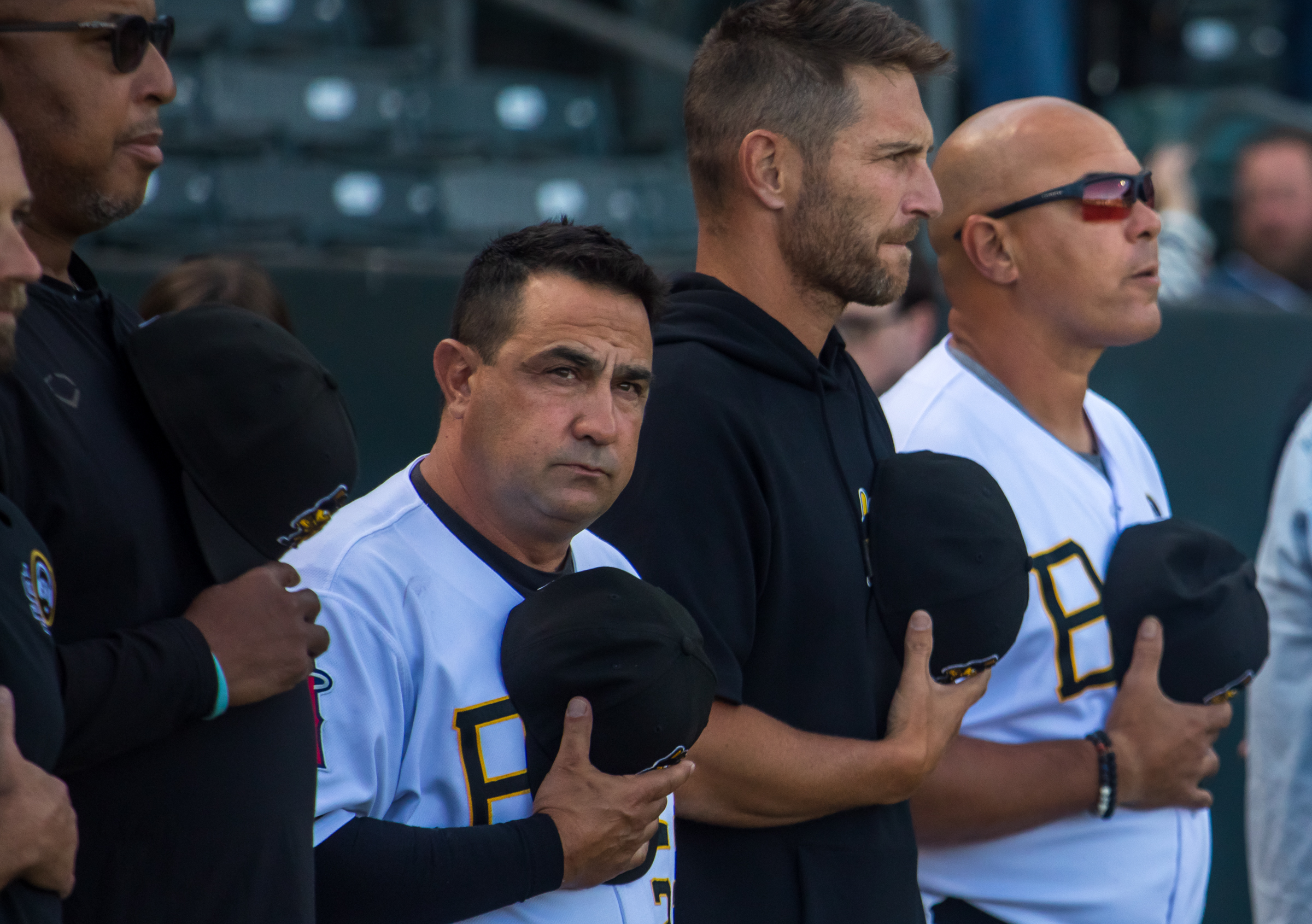 Salt Lake Bees coaches observe a moment of silence for longtime Bees broadcaster Steve Klauke before the team's game against the Reno Aces at Smith's Ballpark on June 18. Klauke died in June, less than a year retiring.