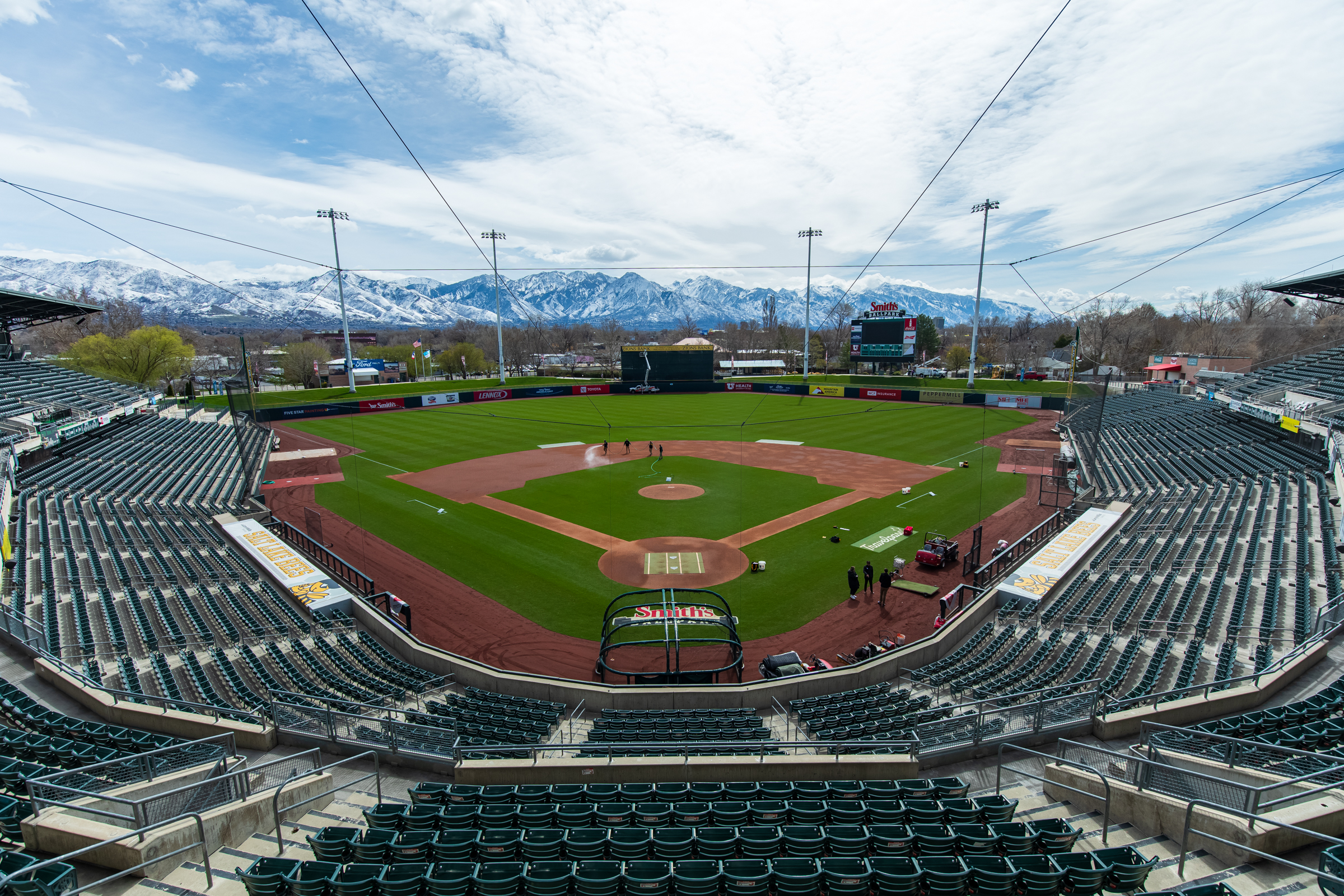 The Salt Lake Bees crew prepares the field before the team's batting practice on March 27, days before the team's final season at Smith's Ballpark.
