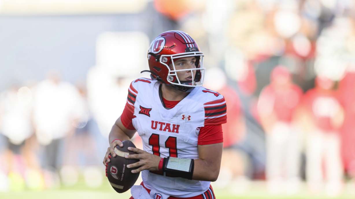 Utah quarterback Isaac Wilson (11) runs out of the pocket from defensive pressure looking to throw the football during an NCAA football game on Saturday, Sept. 14, 2024 in Logan, Utah.