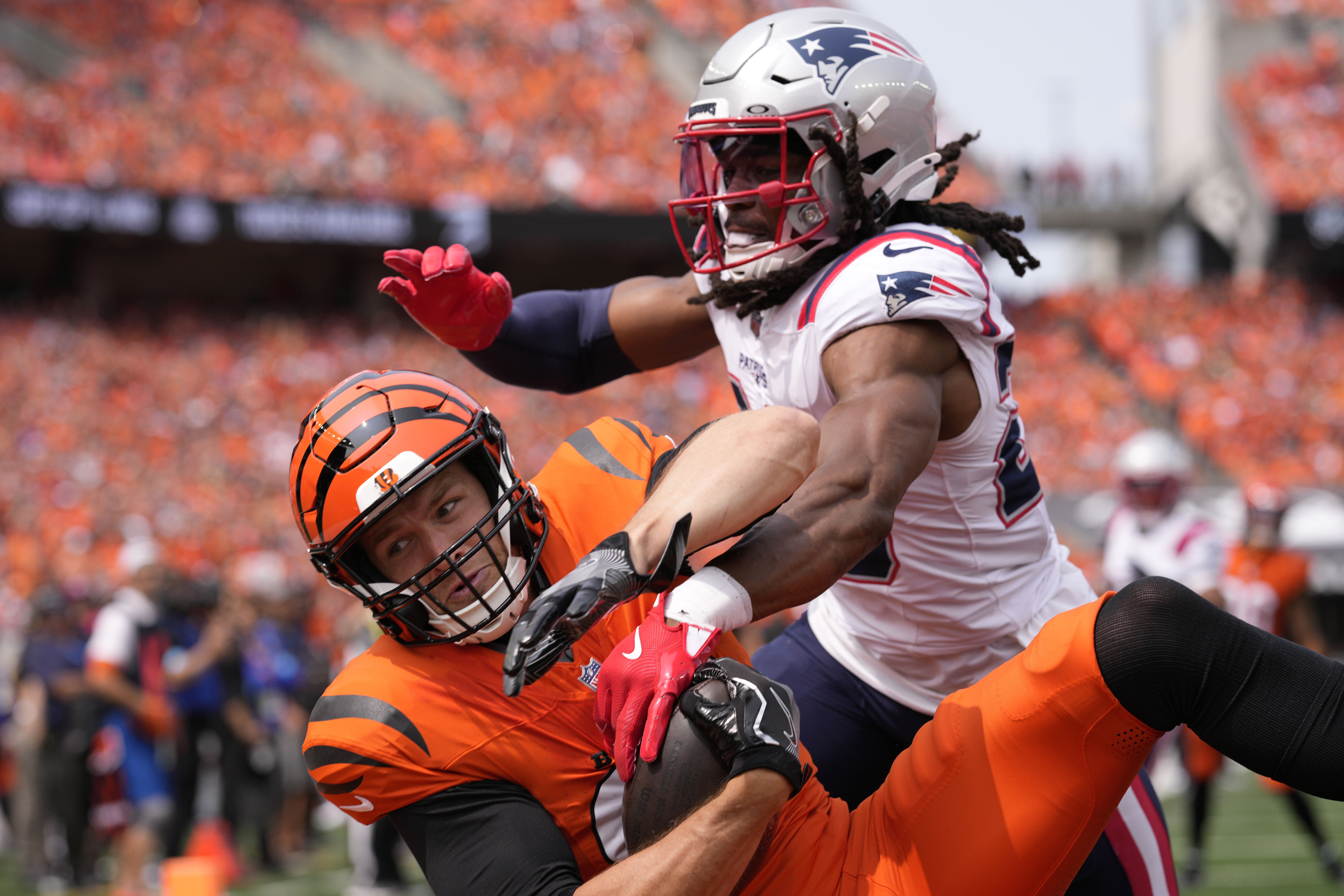 New England Patriots safety Kyle Dugger, right, breaks up a pass intended for Cincinnati Bengals tight end Mike Gesicki during the first half of an NFL football game, Sunday, Sept. 8, 2024, in Cincinnati. 