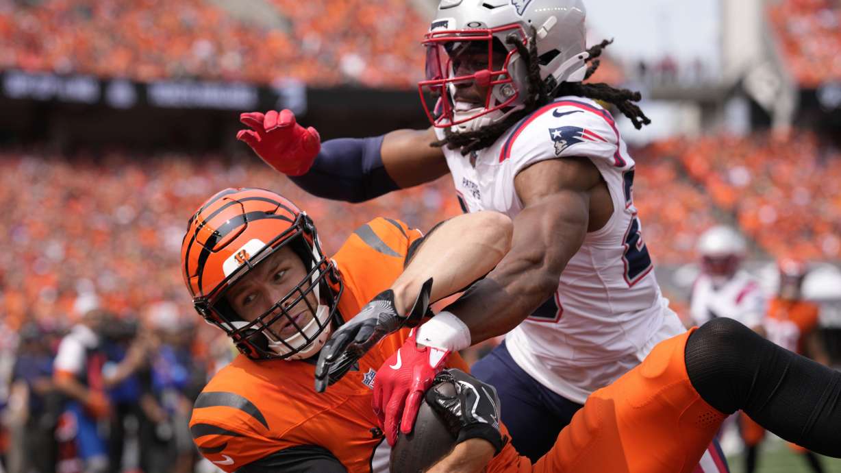New England Patriots safety Kyle Dugger, right, breaks up a pass intended for Cincinnati Bengals tight end Mike Gesicki during the first half of an NFL football game, Sunday, Sept. 8, 2024, in Cincinnati.