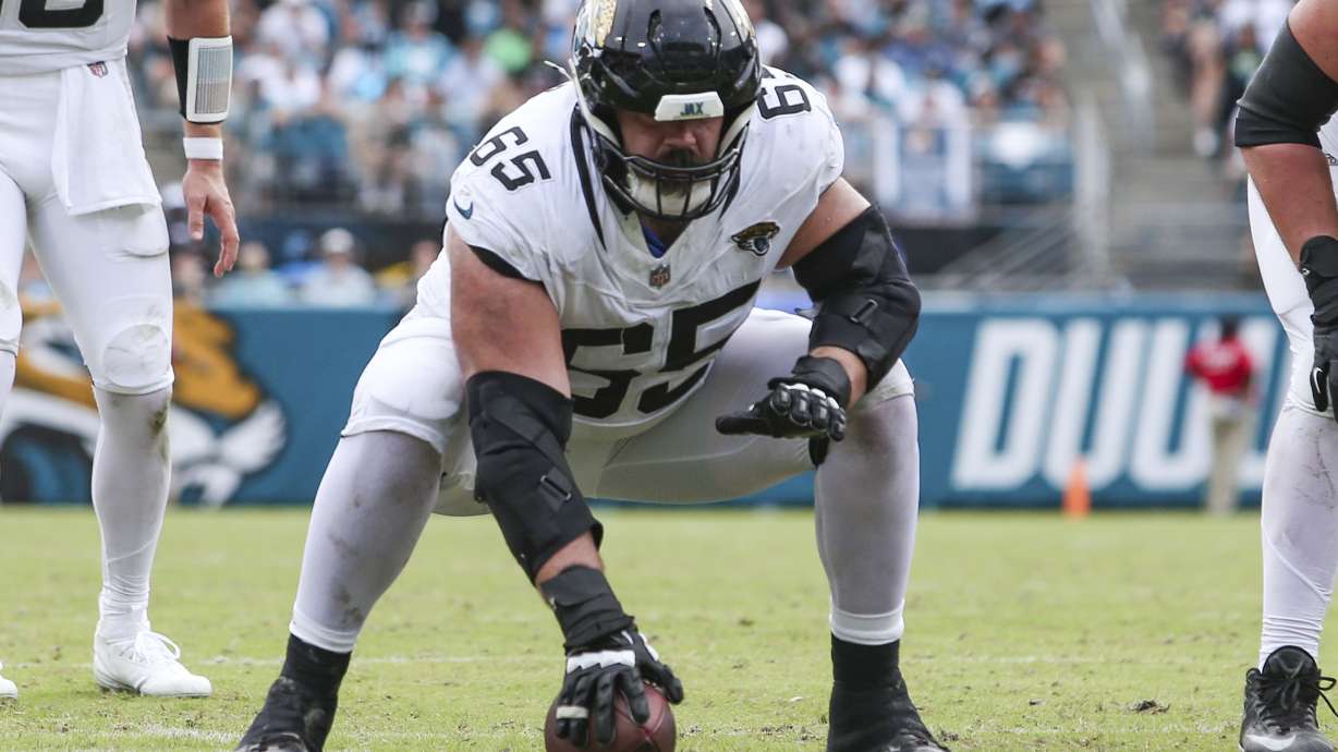FILE - Jacksonville Jaguars center Mitch Morse (65) sets to snap the ball during an NFL football game against the Cleveland Browns in Jacksonville, Fla., Sept. 15, 2024. The Browns defeated the Jaguars 18-13.