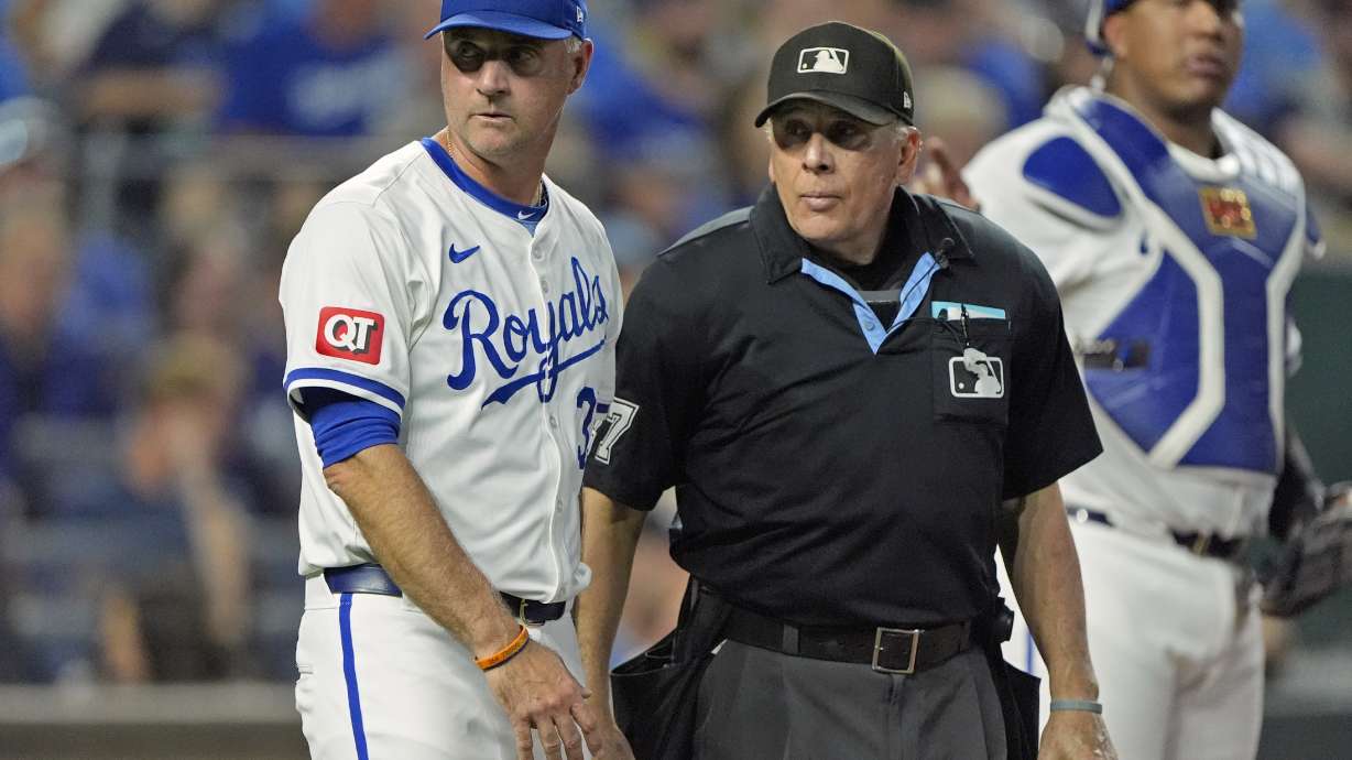 Kansas City Royals manager Matt Quatraro talks to home plate umpire Larry Vanover during the fourth inning of a baseball game against the Detroit Tigers Monday, Sept. 16, 2024, in Kansas City, Mo.