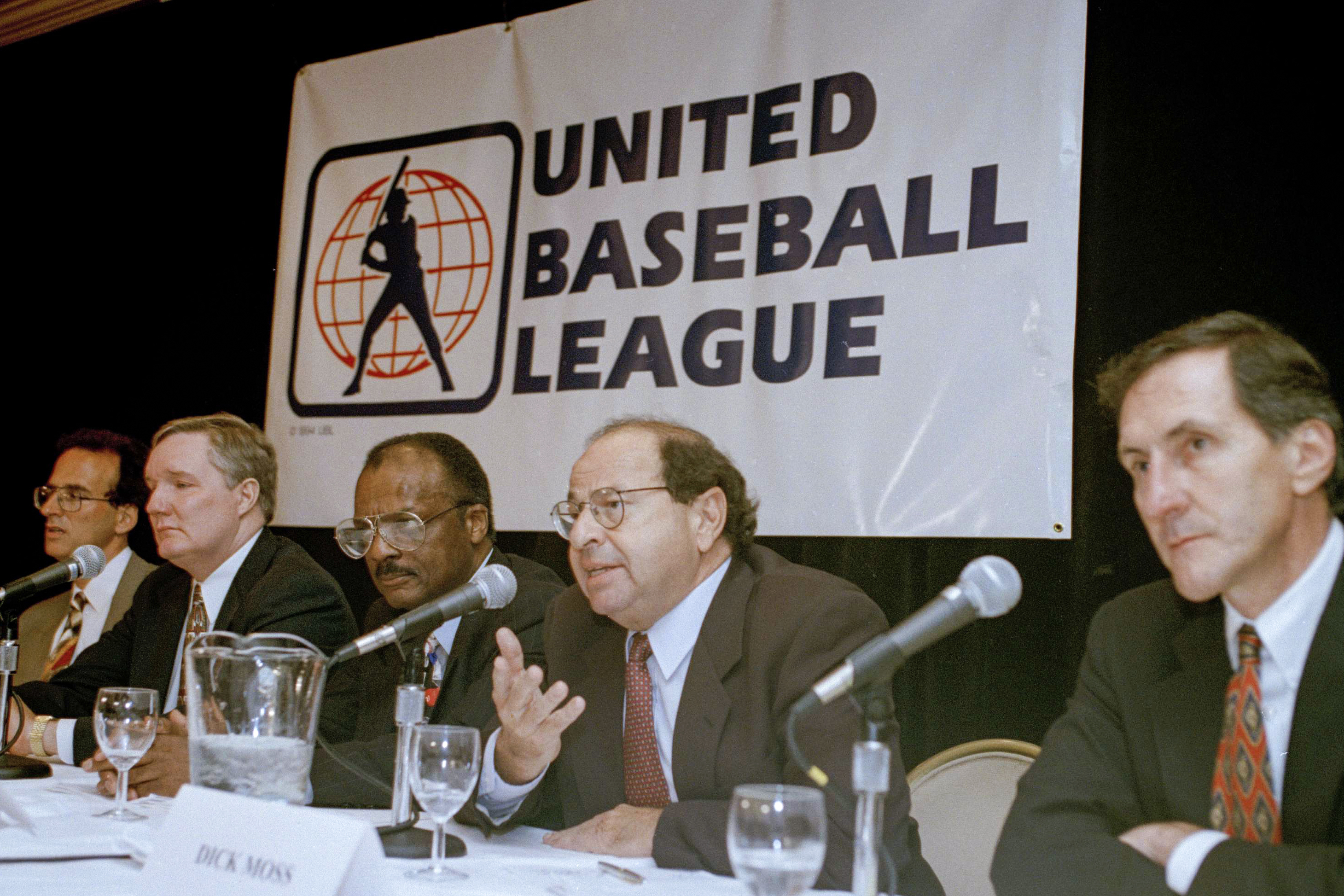 FILE - Agent Dick Moss, second from right, Donald Fehr's predecessor as general counsel of the Major League Players Association, answers a question at a New York news conference, Nov. 1, 1994, announcing the formation of the United Baseball League. From left are Smith College economics professor Andrew Zimbalist; Rep. John Bryant, D-Texas; former major leaguer Curt Flood; Moss, and Robert Mrazek.