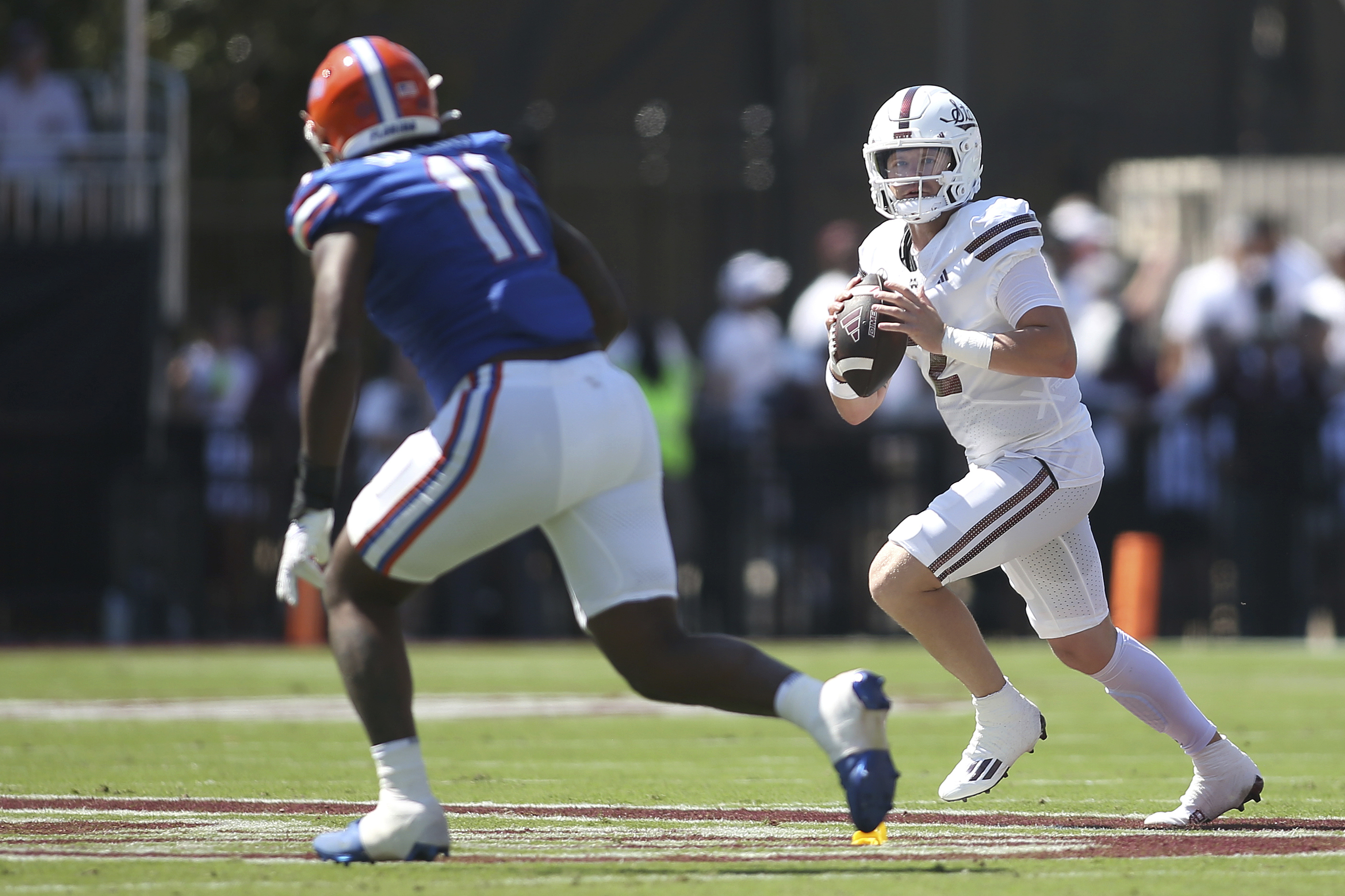 Mississippi State quarterback Blake Shapen (2) looks to pass against Florida defensive end Kelby Collins (11) during the first half of an NCAA college football game in Starkville, Miss., Saturday, Sept. 21, 2024. 