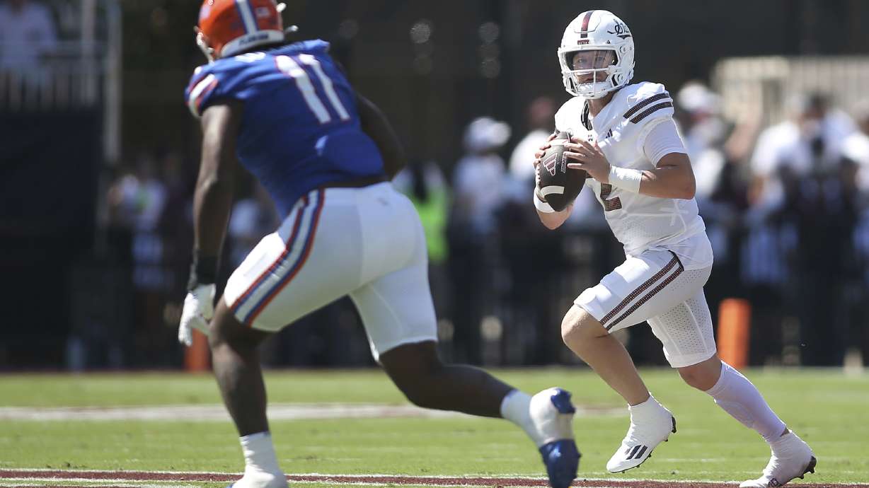 Mississippi State quarterback Blake Shapen (2) looks to pass against Florida defensive end Kelby Collins (11) during the first half of an NCAA college football game in Starkville, Miss., Saturday, Sept. 21, 2024.