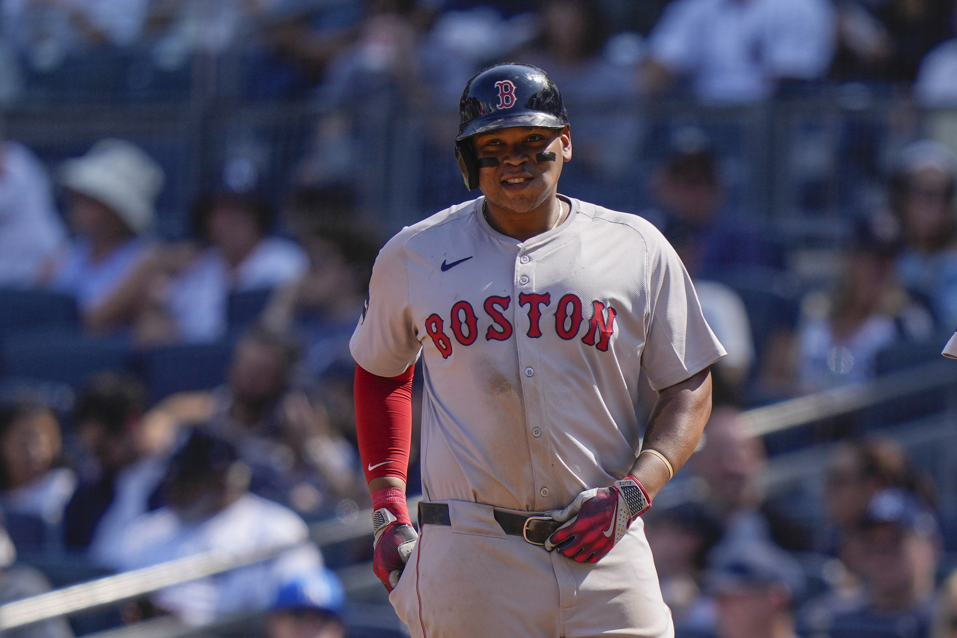 Boston Red Sox's Rafael Devers smiles after hitting a two-run single during the fifth inning of a baseball game against the New York Yankees, Saturday, Sept. 14, 2024, in New York. 
