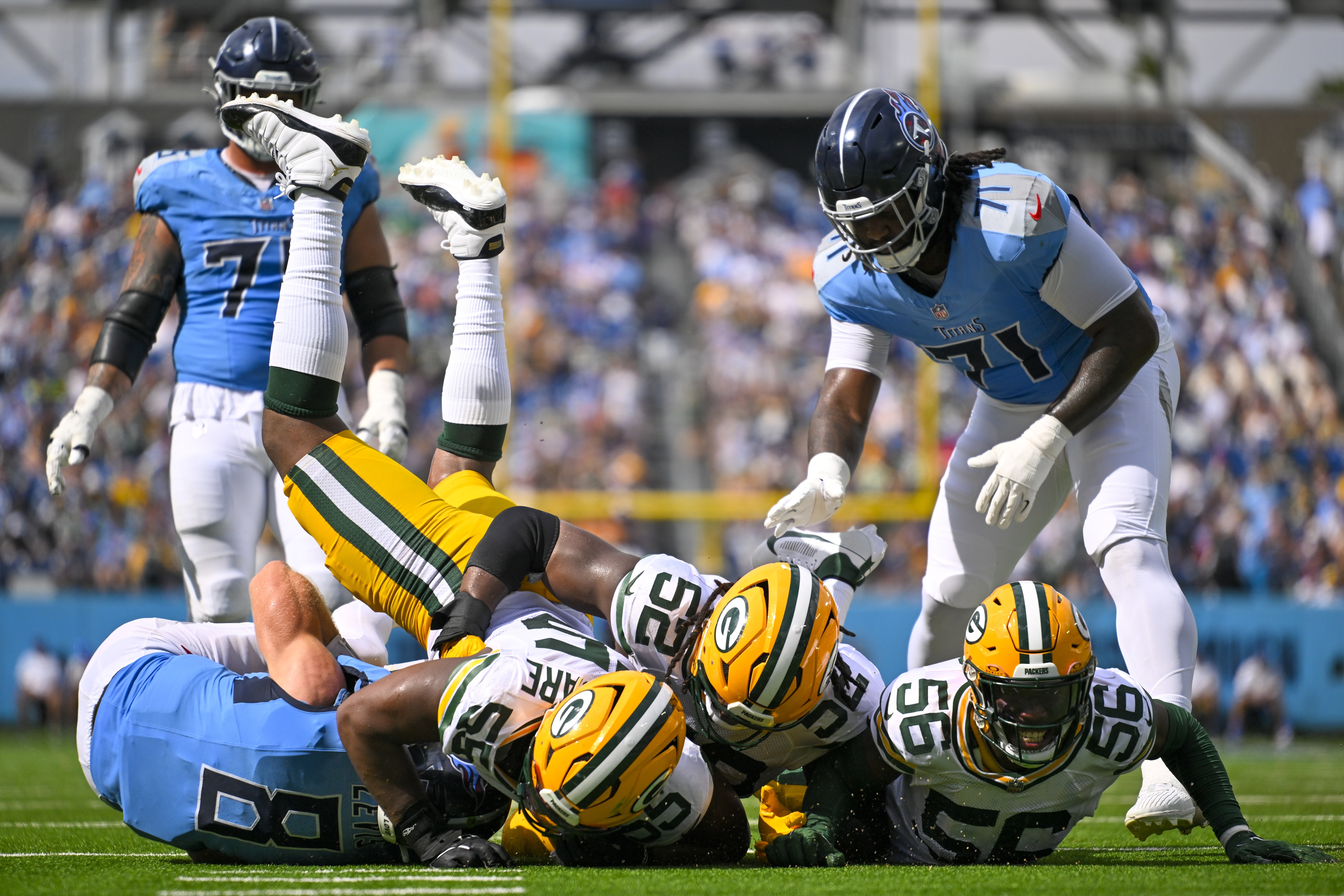 Tennessee Titans' Will Levis is sacked by Green Bay Packers' Kingsley Enagbare (55), Rashan Gary (52) and Edgerrin Cooper (56) during the second half of an NFL football game Sunday, Sept. 22, 2024, in Nashville, Tenn. 
