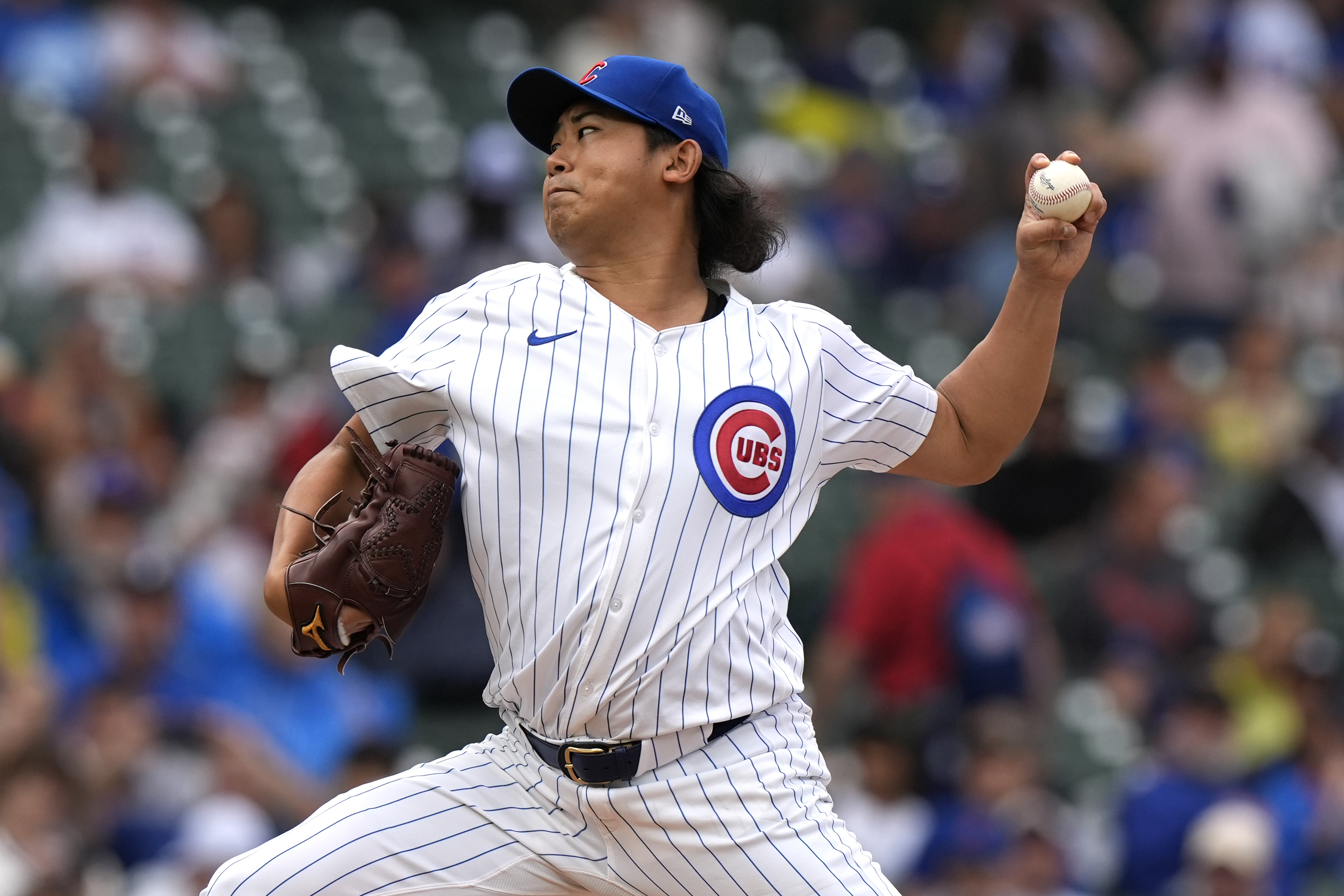 Chicago Cubs starting pitcher Shota Imanaga, of Japan, throws against the Washington Nationals during the first inning of a baseball game in Chicago, Sunday, Sept. 22, 2024.
