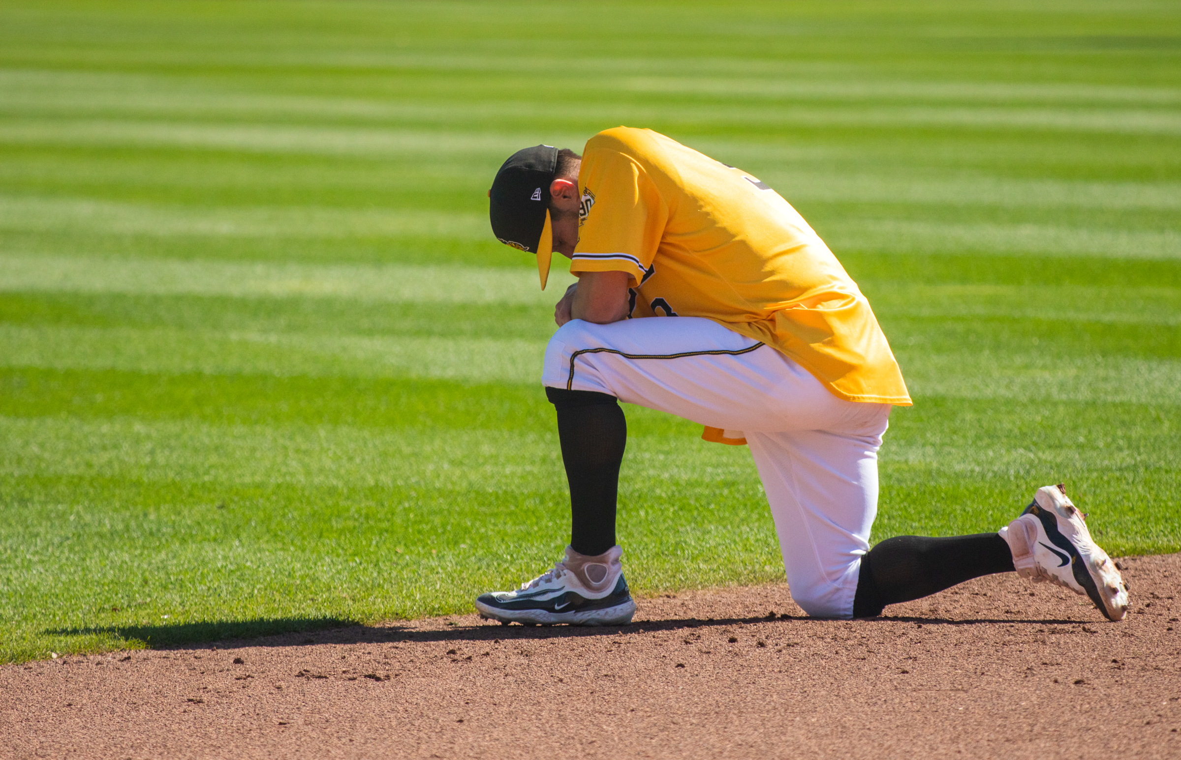 Salt Lake Bees infielder Elliot Soto kneels in prayer following the Bees' final game at Smith's Ballpark on Sunday.