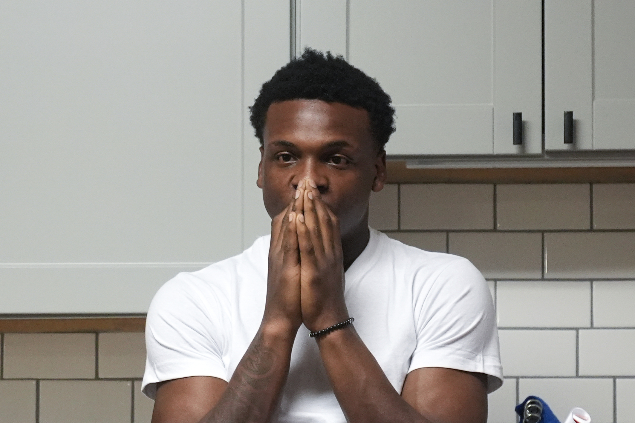 Armorion Smith, an NCAA football player at Michigan State, takes a moment by himself at home in Lansing, Mich., Tuesday, Sept. 3, 2024. 