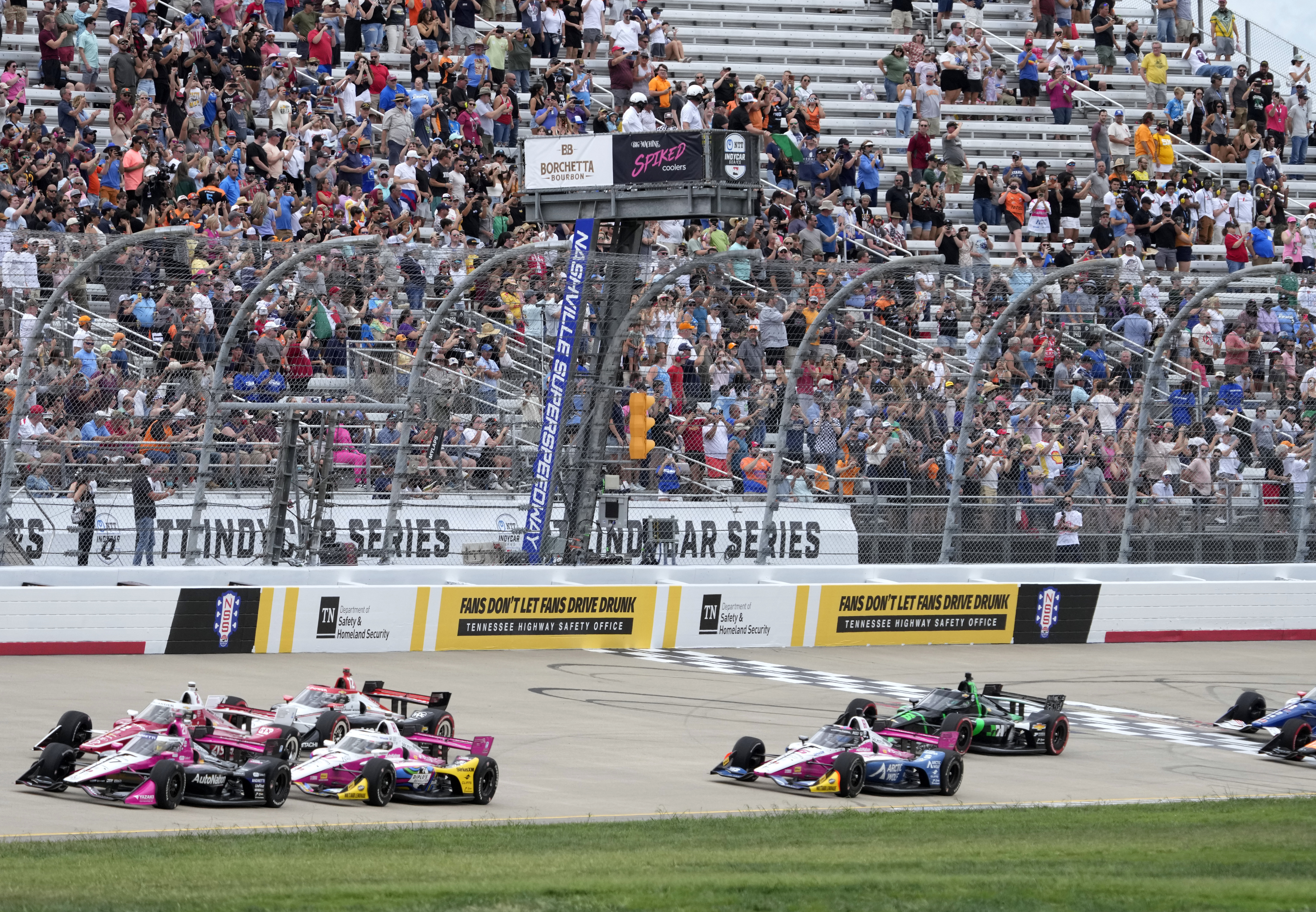 Drives pass under the green flag as they start an IndyCar auto race Sunday, Sept. 15, 2024, at Nashville Superspeedway in Lebanon, Tenn.