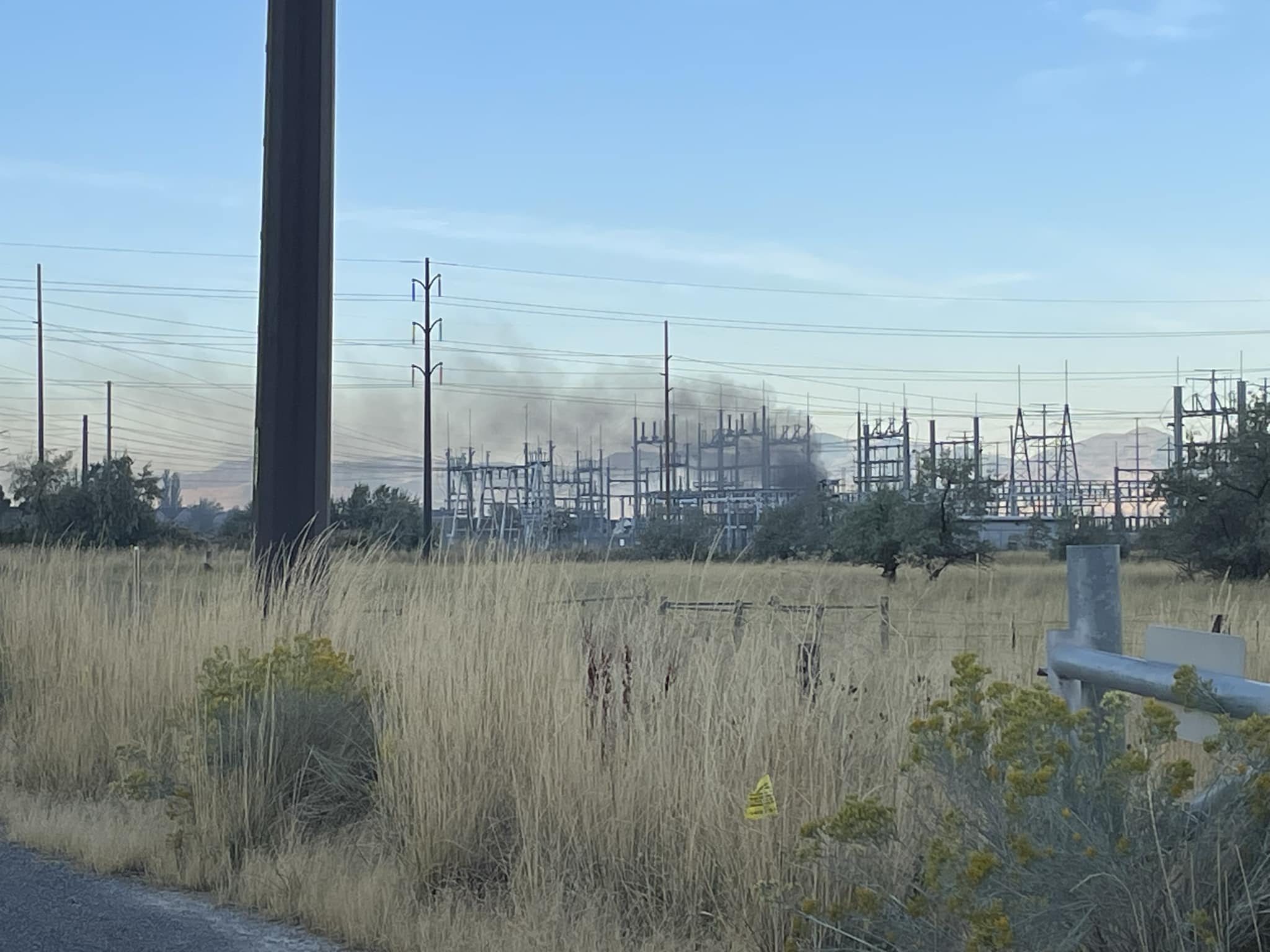 Smoke is seen at a Centerville substation after a fire caused widespread outages in south Davis County on Monday.