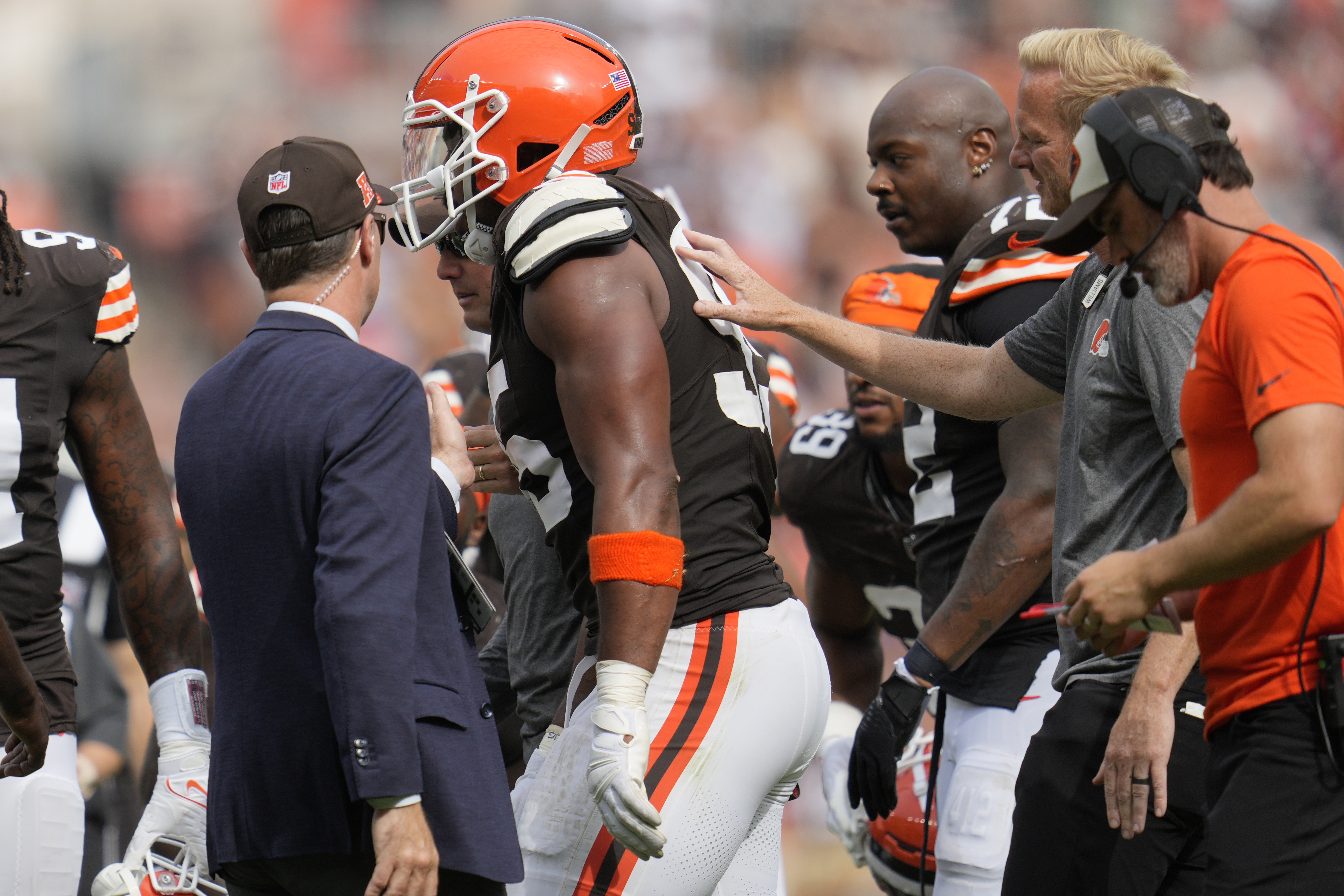 Cleveland Browns' Myles Garrett is helped off the field after an injury in the second half of an NFL football game against the New York Giants, Sunday, Sept. 22, 2024, in Cleveland.
