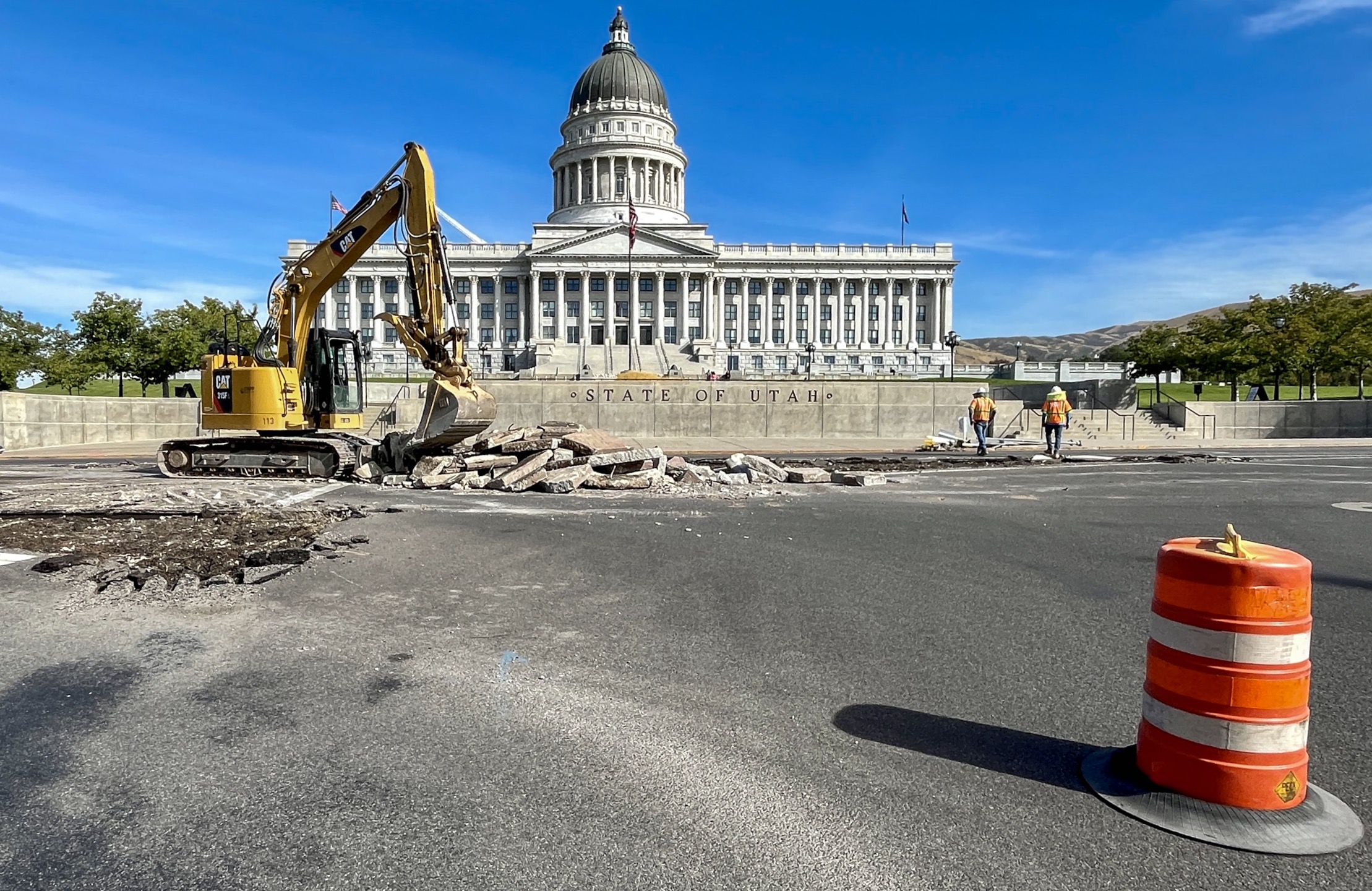 Construction crews dig into the intersection of 300 North and State Street in Salt Lake City Monday. Utah Department of Transportation officials say the current design will be replaced with a new roundabout.