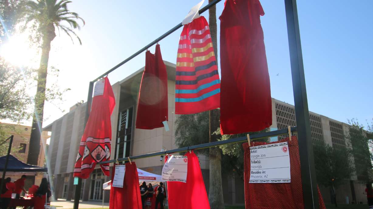 Red skirts are on display at the Arizona State Capitol in Phoenix, May 5, 2021, to raise awareness for missing and murdered Indigenous women and girls. A man was sentenced to life in prison Monday in the death of a Navajo woman.