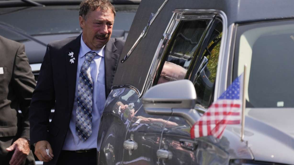 Guy Gaudreau looks into a hearse containing the remains of his son Columbus Blue Jackets hockey player John Gaudreau after his and his brother's Matthew Gaudreau funeral at St. Mary Magdalen Catholic Church in Media, Pa., Monday, Sept. 9, 2024.
