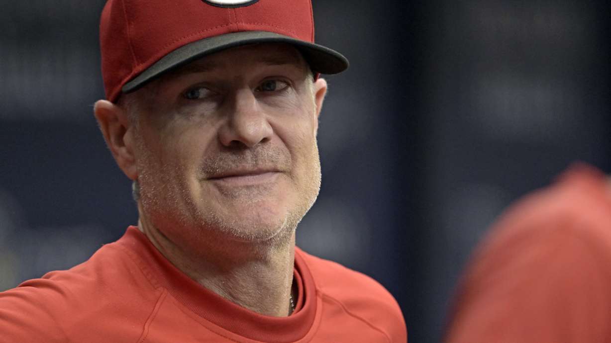 FILE - Cincinnati Reds manager David Bell stands in the dugout during a baseball game against the Tampa Bay Rays, July 28, 2024, in St. Petersburg, Fla.