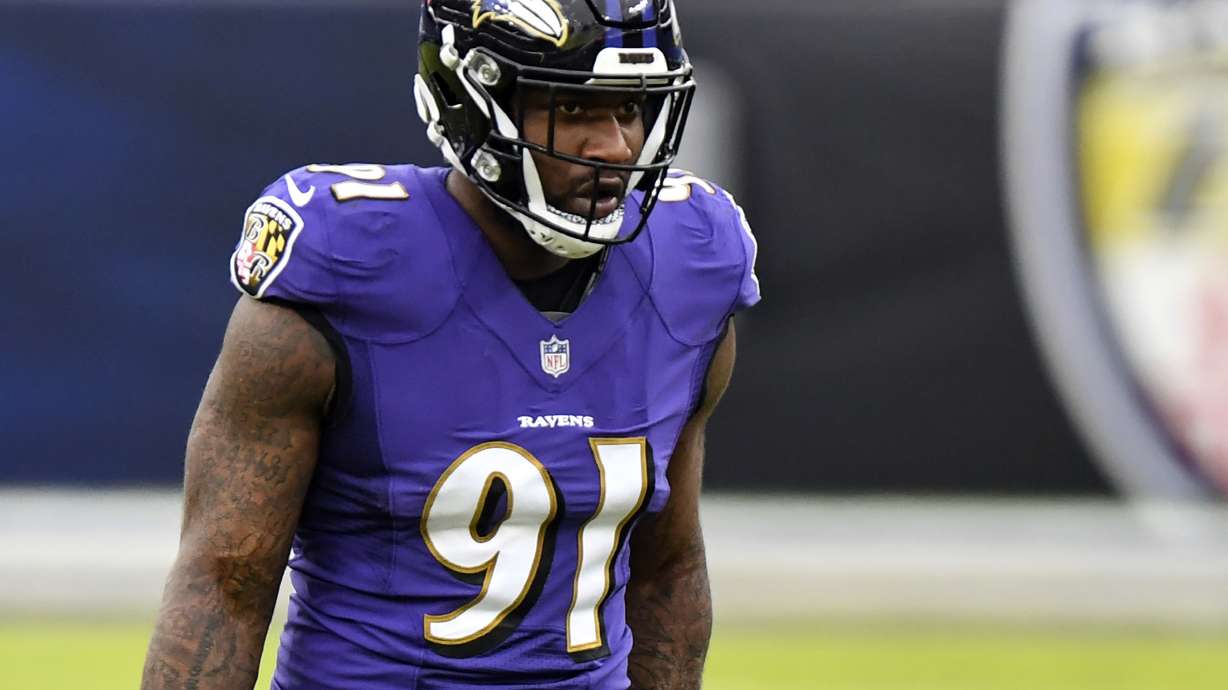 FILE - Baltimore Ravens defensive end Yannick Ngakoue looks on during the second half of an NFL football game against the Jacksonville Jaguars, Dec. 20, 2020, in Baltimore.