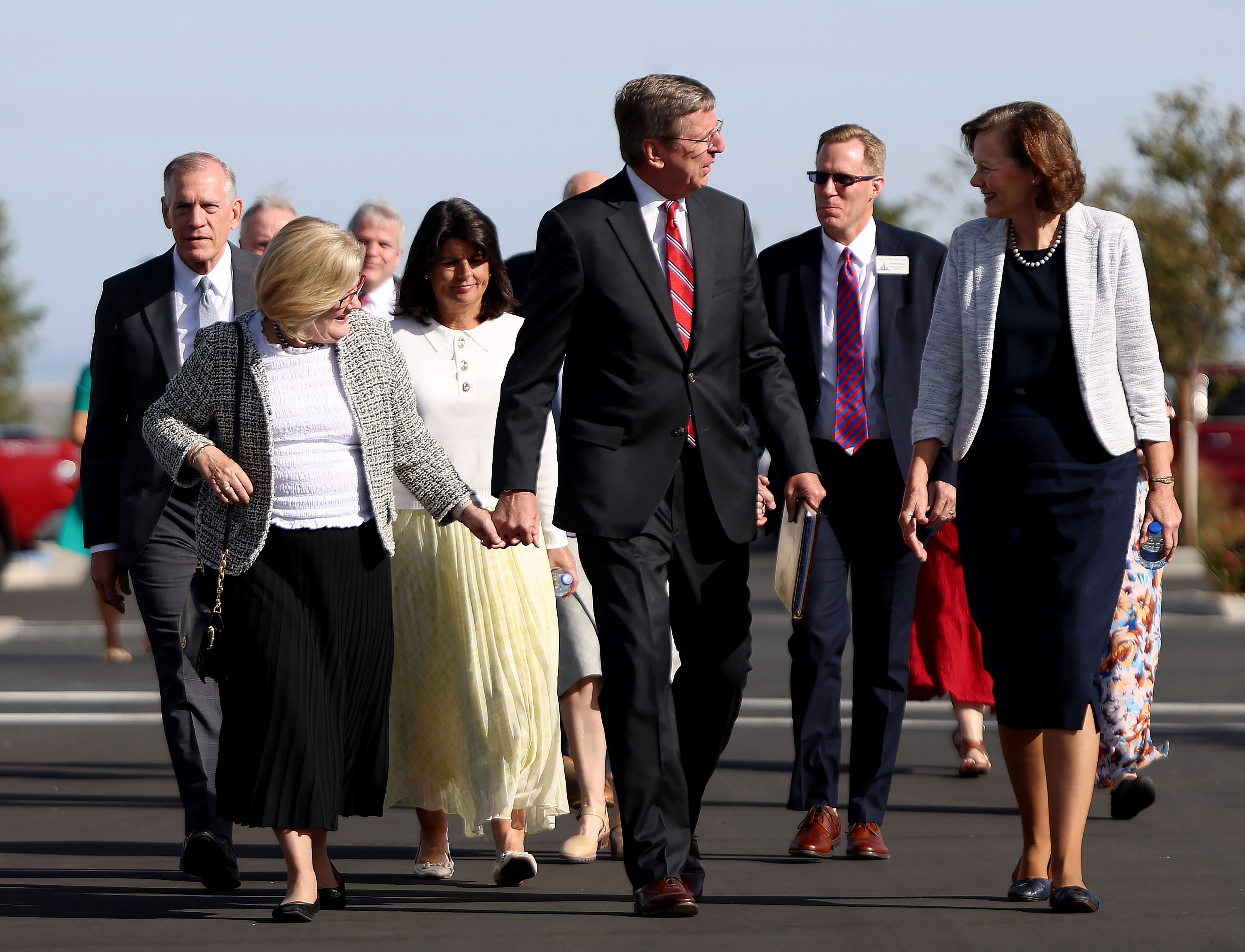 Church leaders and guests walk to the Deseret Peak Utah Temple in Tooele on Monday.