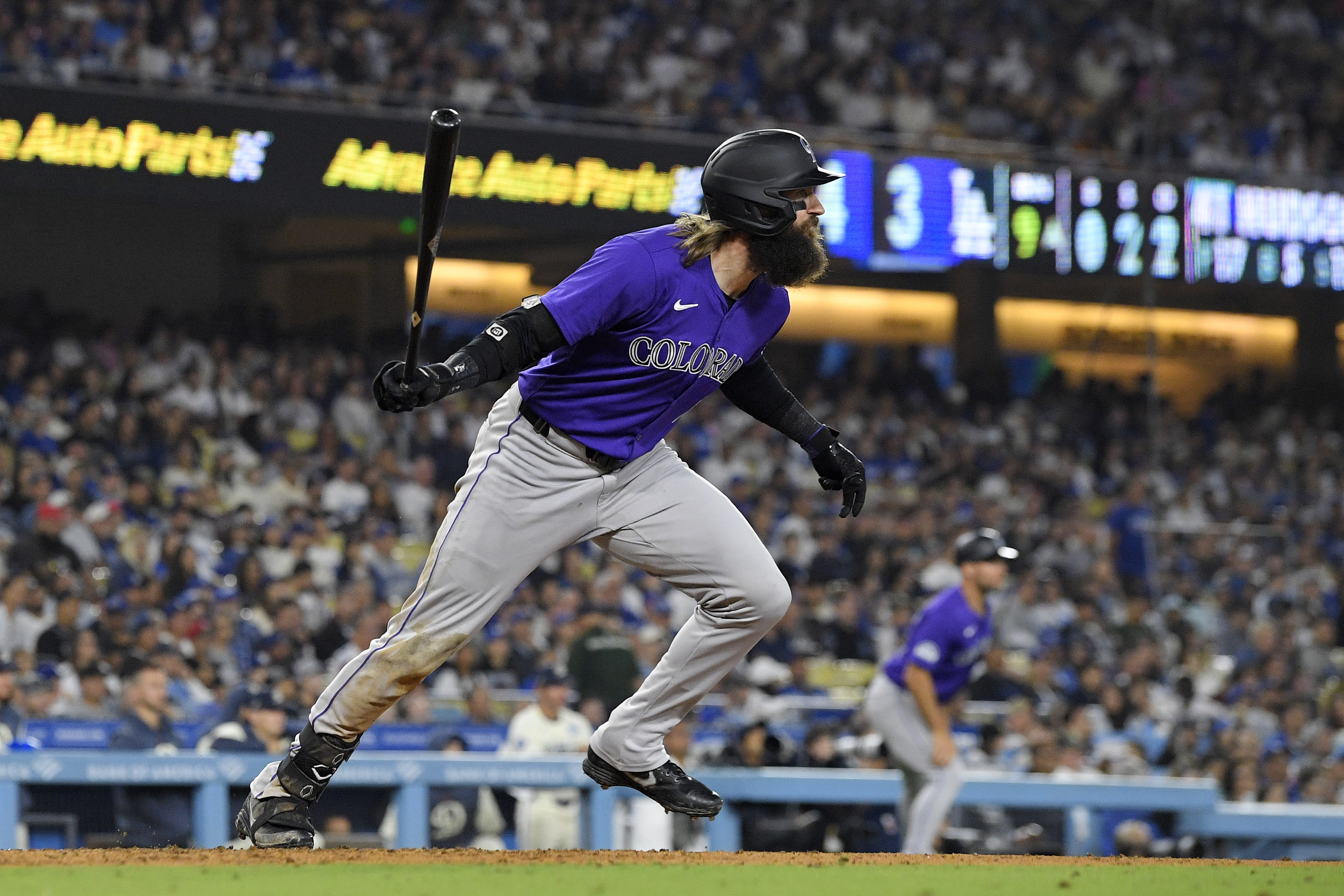 Colorado Rockies' Charlie Blackmon heads to first for a two-run home run during the ninth inning of a baseball game against the Los Angeles Dodgers, Saturday, Sept. 21, 2024, in Los Angeles. 