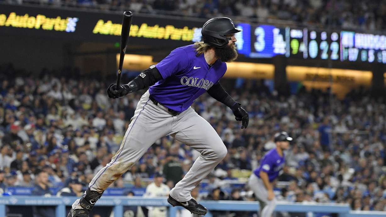 Colorado Rockies' Charlie Blackmon heads to first for a two-run home run during the ninth inning of a baseball game against the Los Angeles Dodgers, Saturday, Sept. 21, 2024, in Los Angeles.