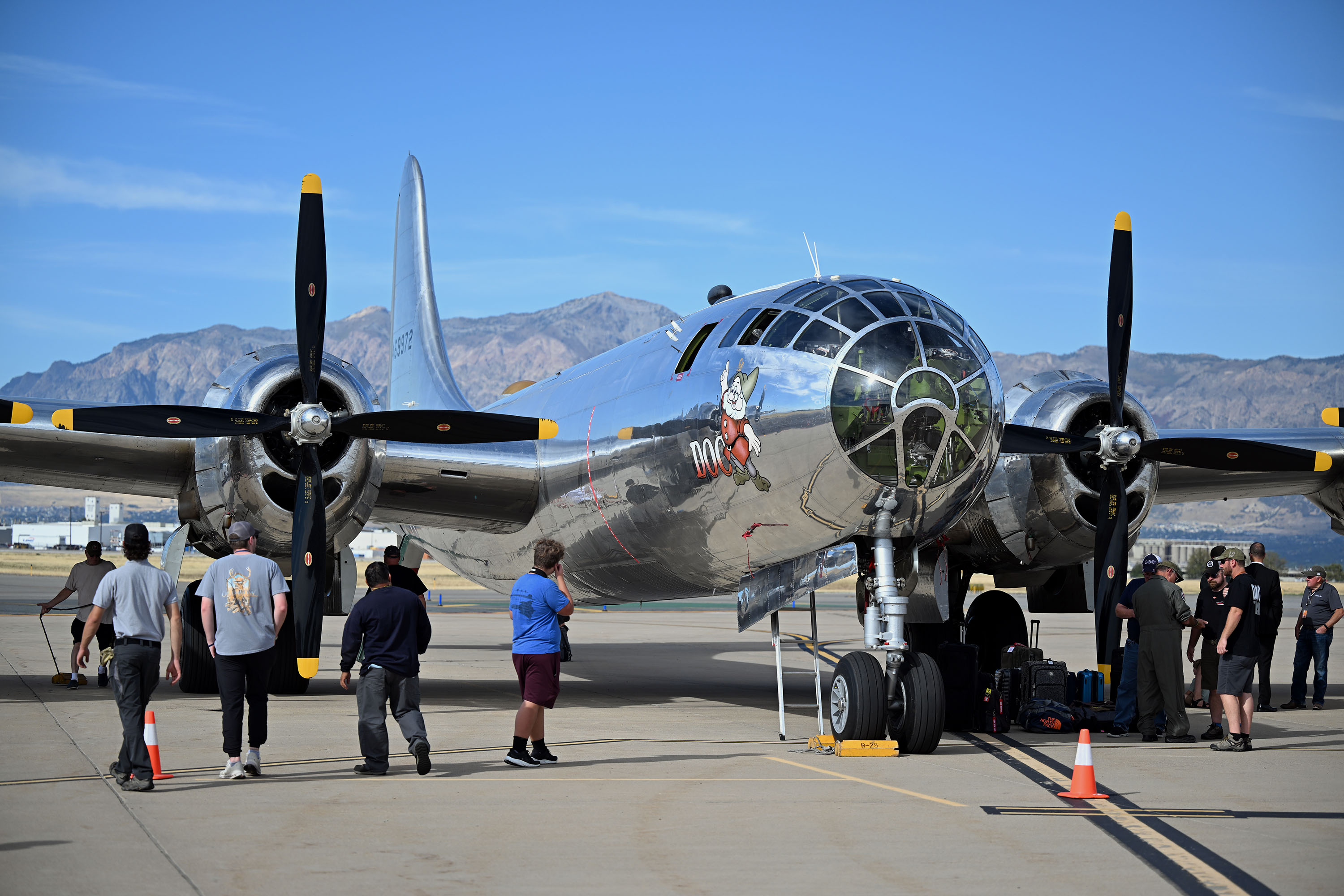 Plane enthusiasts admire Doc, one of only two flying B-29 Superfortress planes still flying worldwide, sitting at Ogden-Hinckley Regional Airport on Monday.