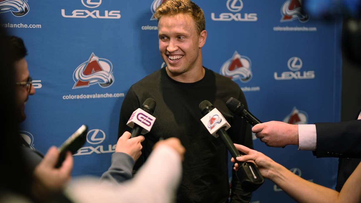 Colorado Avalanche right wing Logan O'Connor responds to questions during a news conference to announce that he signed a six-year contract extension with the hockey club Monday, Sept. 23, 2024, in Denver.