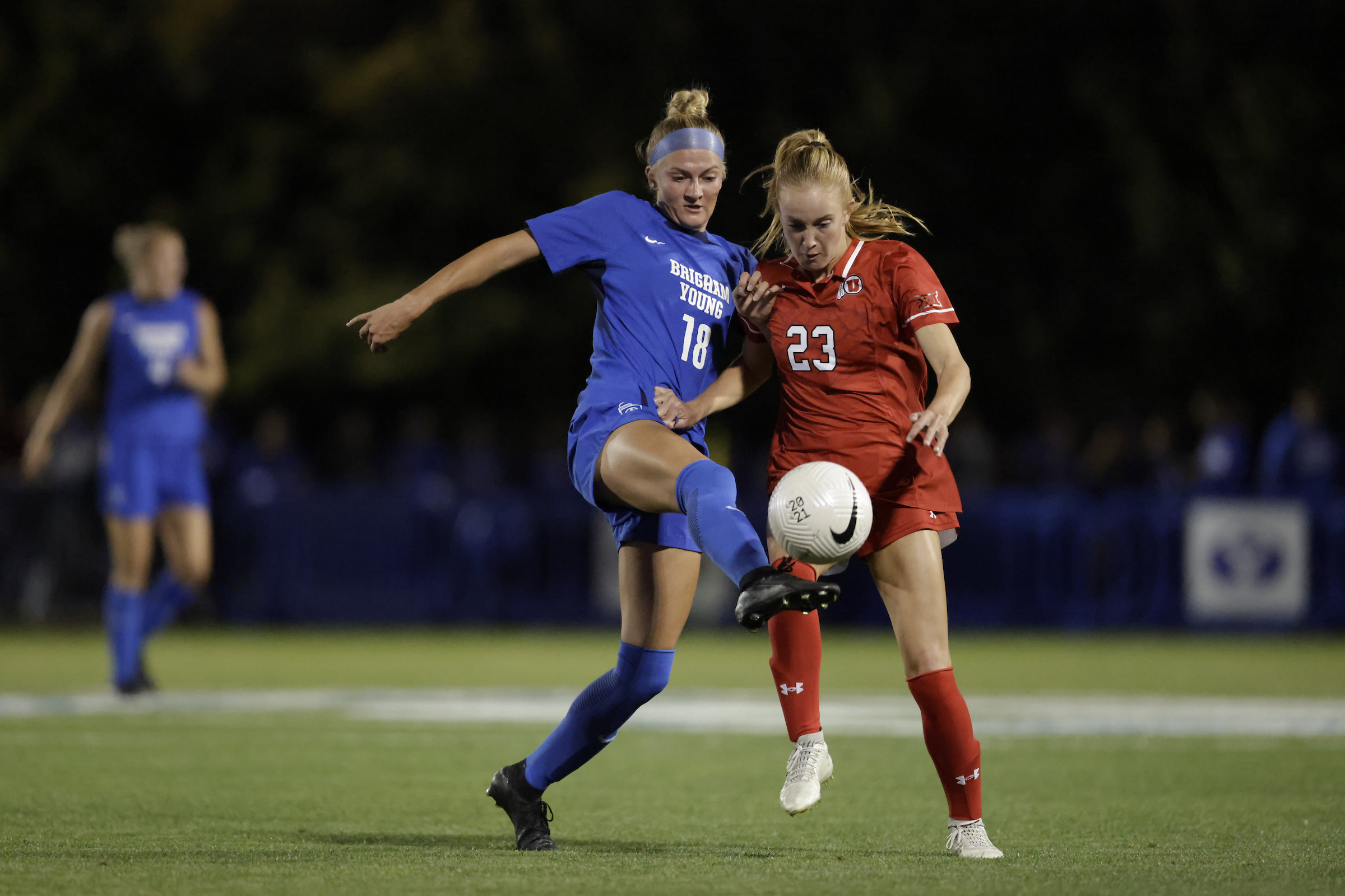 BYU's Mika Krommenhoek and Utah's Katie Callaway wrestle for the ball during a Big 12 women's soccer game, Monday, Sept. 23, 2024, at South Field in Provo, Utah.