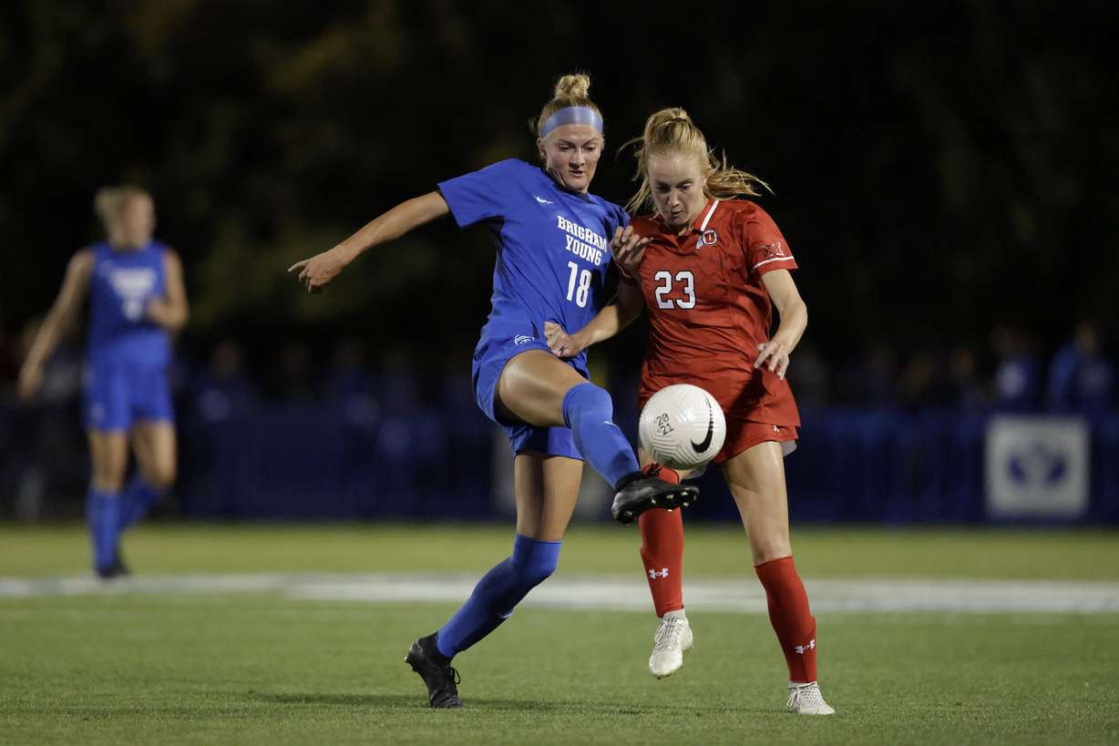 BYU's Mika Krommenhoek and Utah's Katie Callaway jostle for the ball during a Big 12 women's soccer match, Monday, Sept. 23, 2024 at South Field in Provo, Utah.