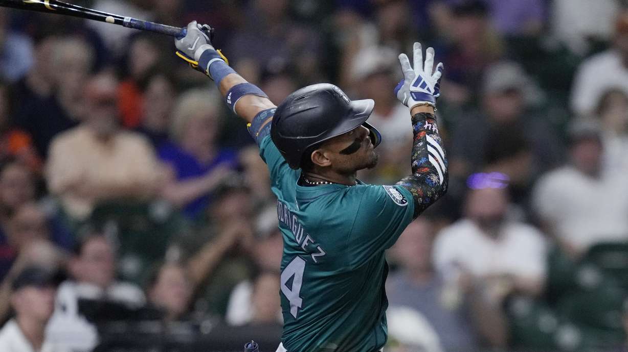 Seattle Mariners' Julio RodrÃguez hits an RBI double during the ninth inning of a baseball game against the Houston Astros, Monday, Sept. 23, 2024, in Houston.