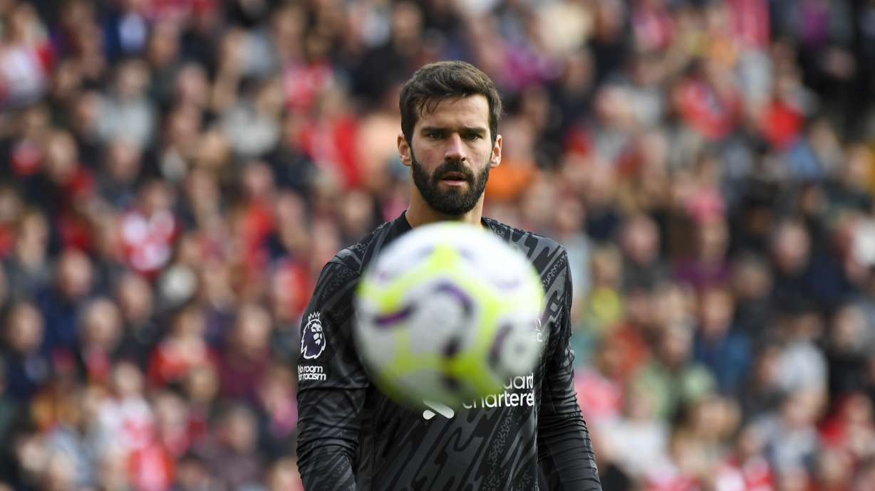 Liverpool's goalkeeper Alisson looks the ball during the English Premier League soccer match between Liverpool and Nottingham Forest at Anfield Stadium in Liverpool, England, Saturday, Sept. 14, 2024.