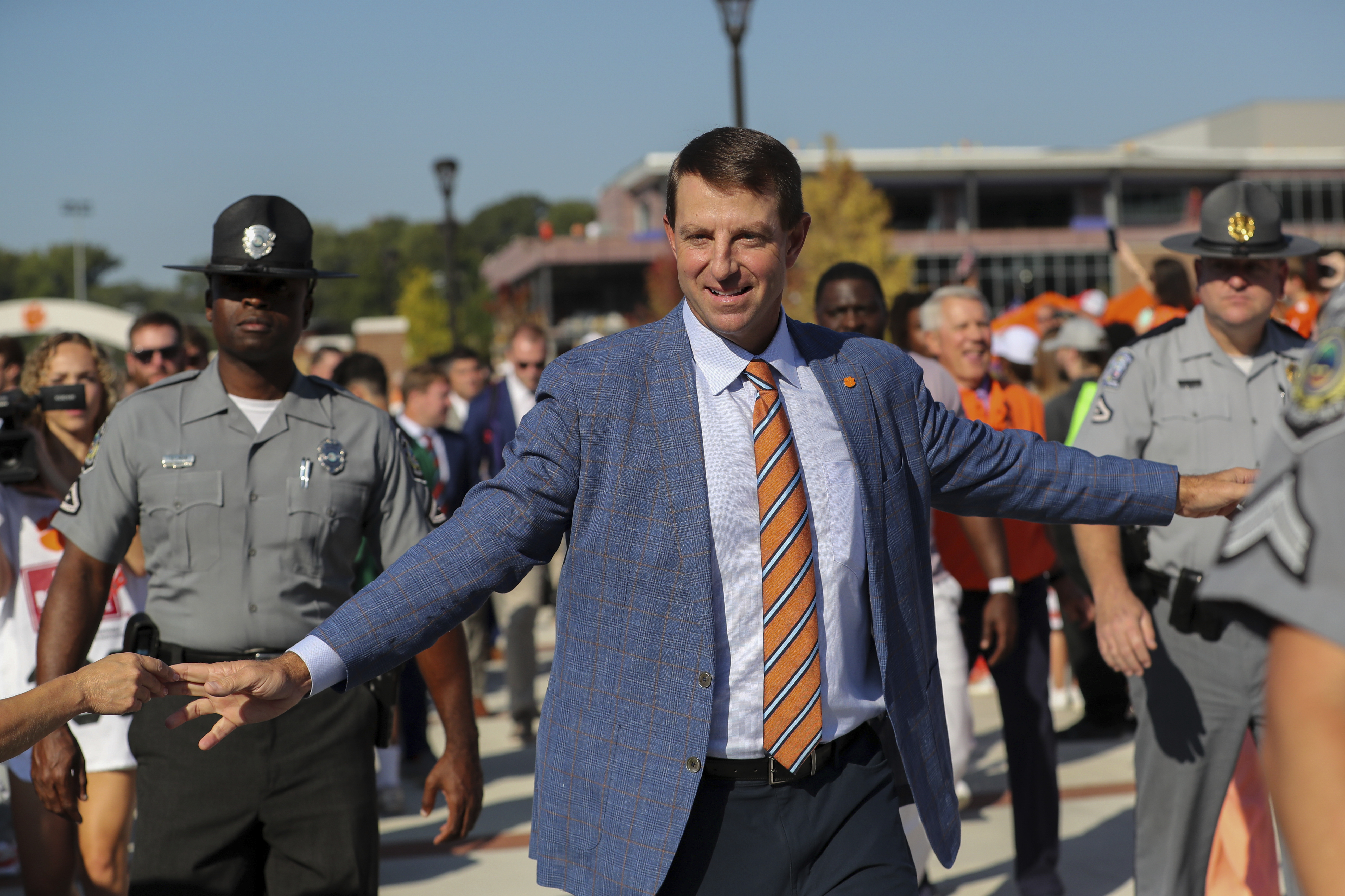 Clemson head coach Dabo Swinney greets fans during the Tiger Walk before an NCAA college football game against North Carolina State Saturday, Sept. 21, 2024, in Clemson, S.C. 