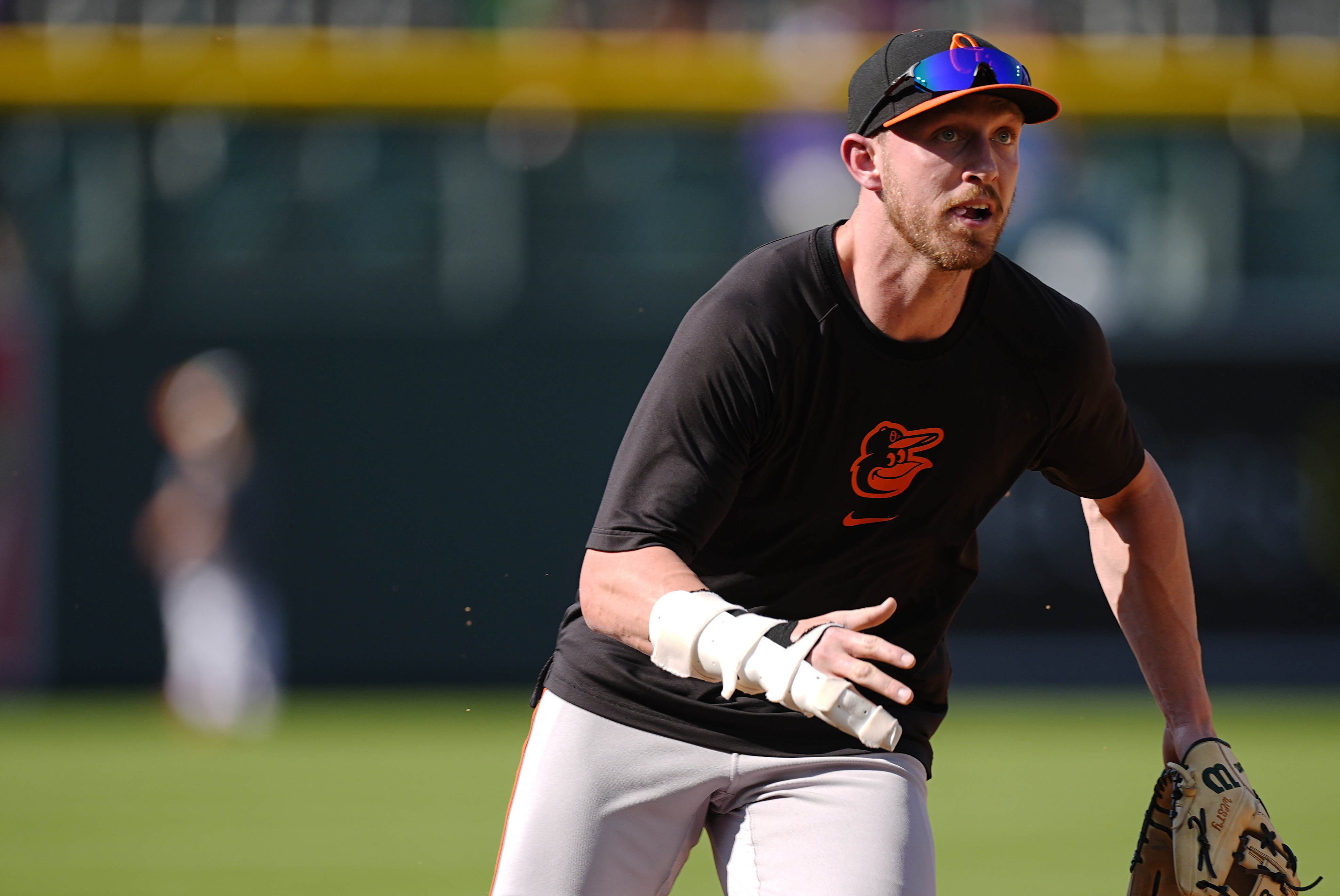 Injured Baltimore Orioles first baseman Ryan Mountcastle warms up before a baseball game against the Colorado Rockies, Saturday, Aug. 31, 2024, in Denver. 
