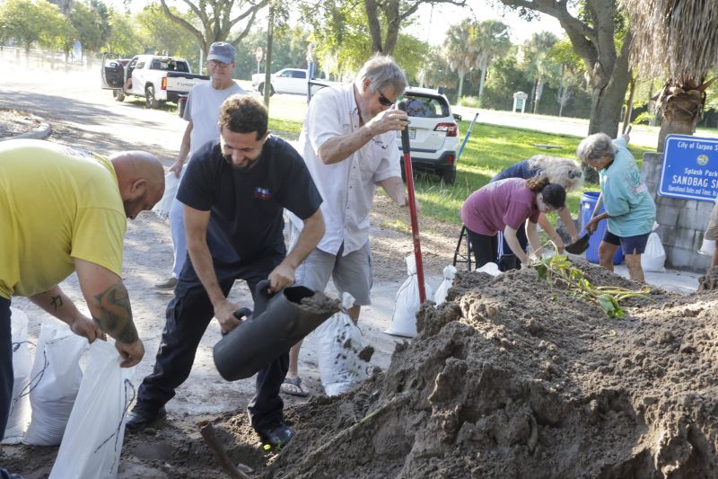 Sandbags are filled while residents prepare their homes for potential flooding, Tuesday in Tarpon Springs, Fla., as Tropical Storm Helene approaches.
