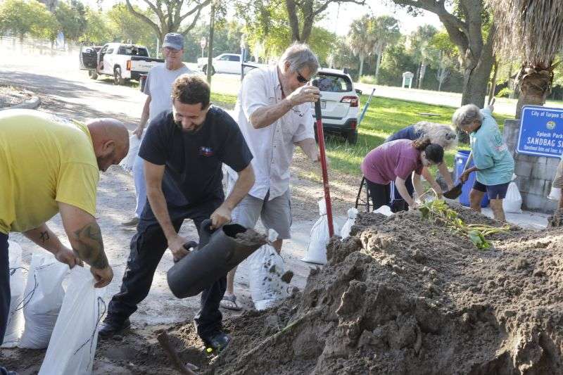 Sandbags are filled while residents prepare their homes for potential flooding, Tuesday in Tarpon Springs, Fla., as Tropical Storm Helene approaches.