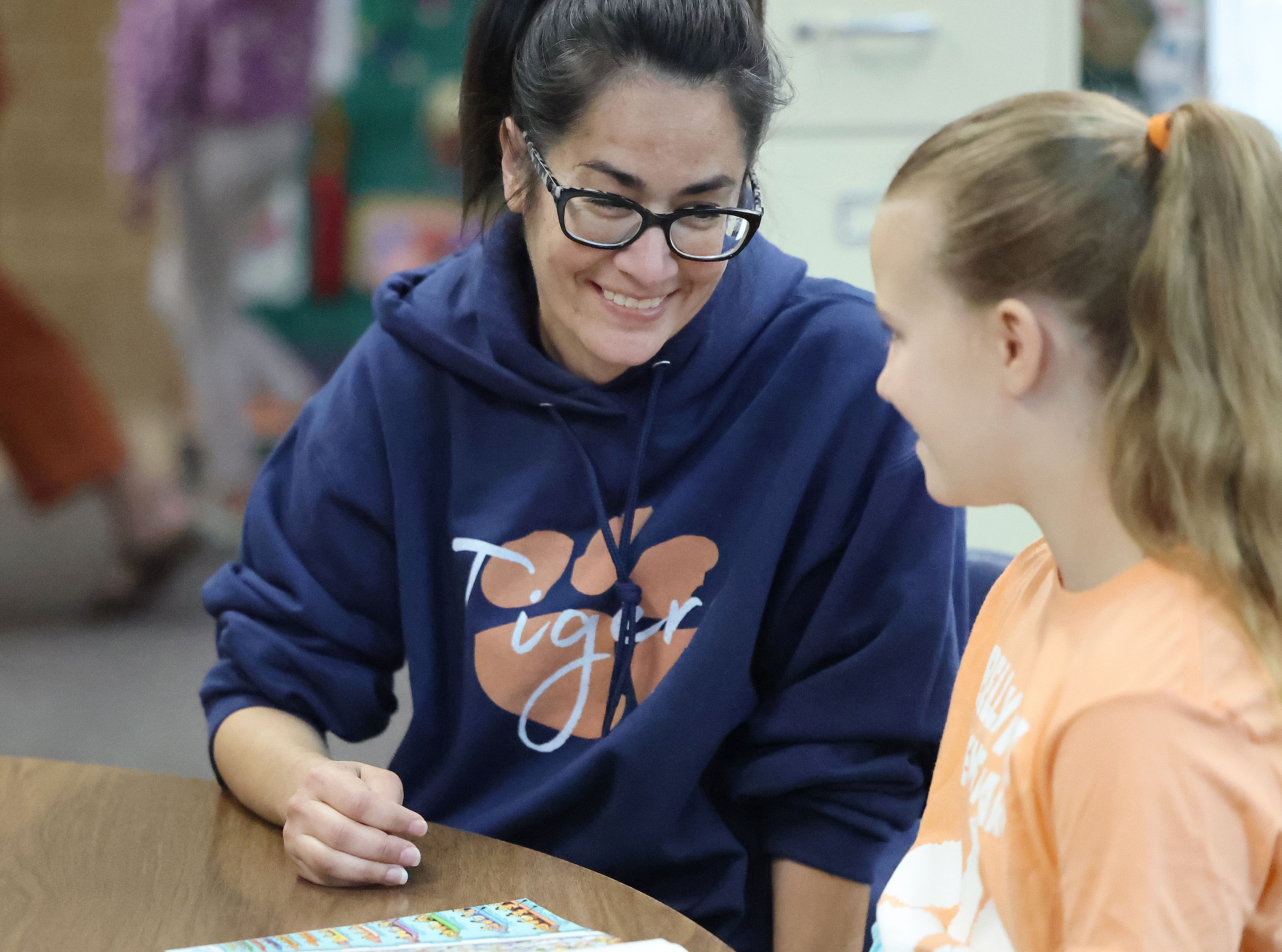 Bella Vista Elementary parent volunteer Alisha Betenson reads with third-grader Sadie Tucker in Cottonwood Heights on Tuesday. Research shows parents and educators differ in their perception of parental engagement and access to curriculum.