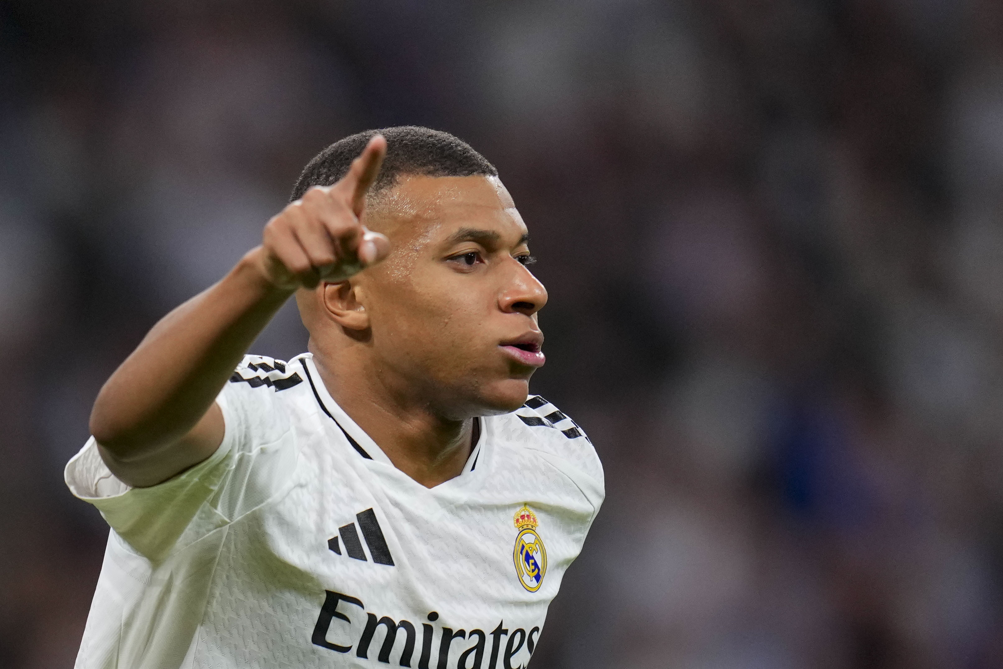 Real Madrid's Kylian Mbappe celebrates after scoring his side's second goal during a Spanish La Liga soccer match between Real Madrid and Alaves at Santiago Bernabeu stadium in Madrid, Spain, Tuesday, Sept. 24, 2024.