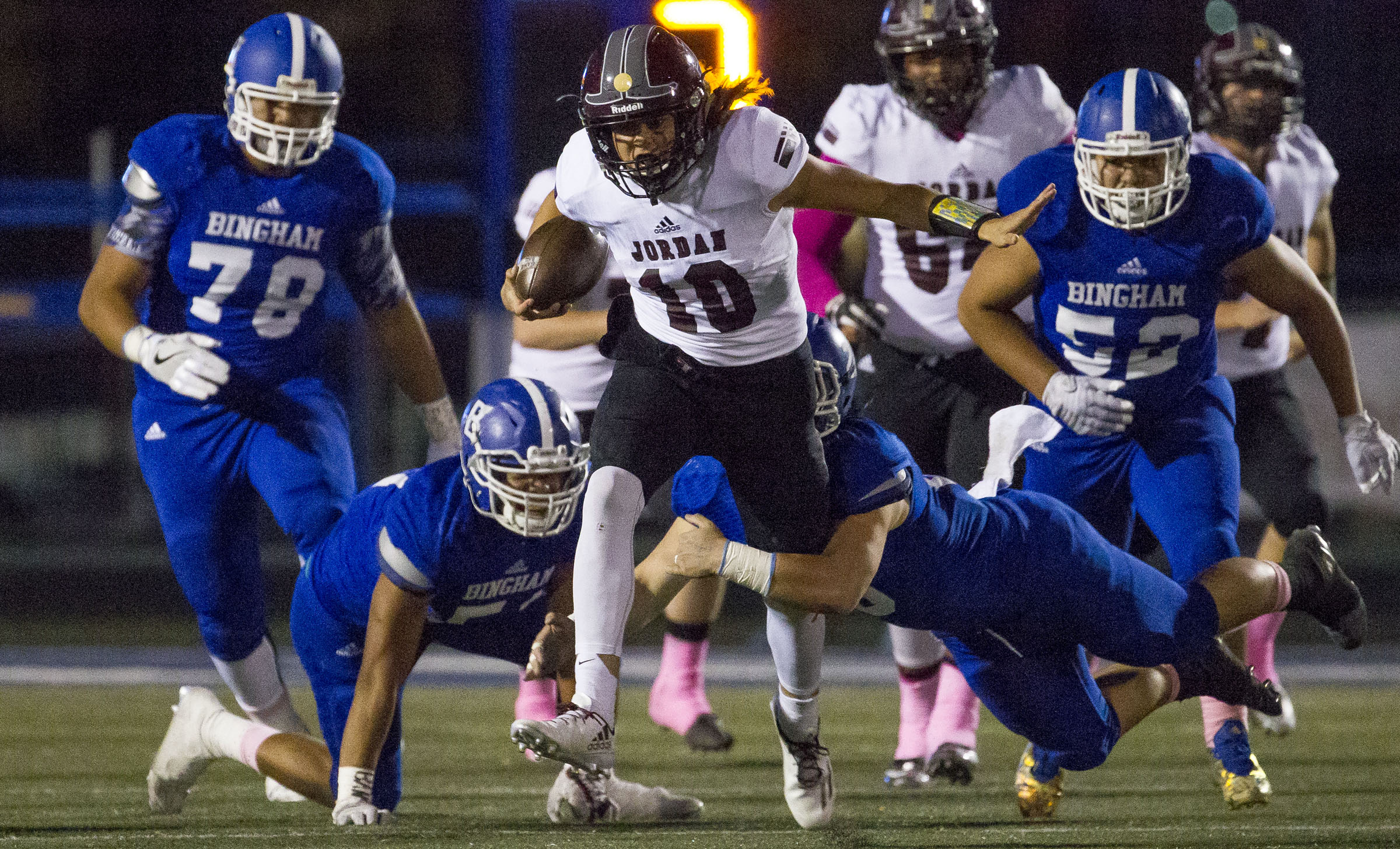 Jordan quarterback Crew Wakley carries a Bingham defender upfield during a UHSAA football game in South Jordan on Thursday, Oct. 13, 2016.