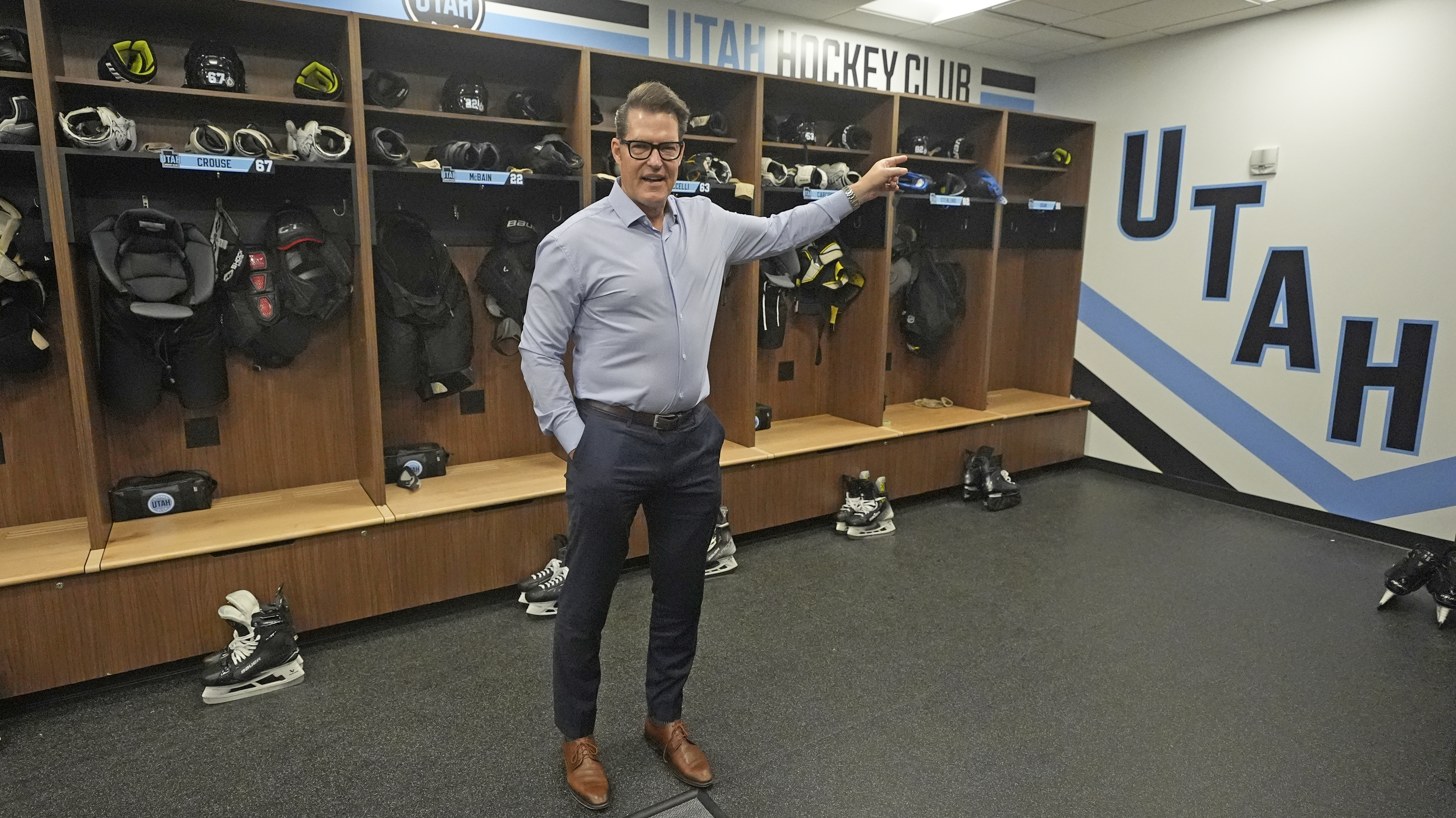 Utah Hockey Club general manager Bill Armstrong points during a tour of the new temporary practice facility locker room at the Olympic Oval Tuesday, Sept. 17, 2024, in Kearns, Utah. 