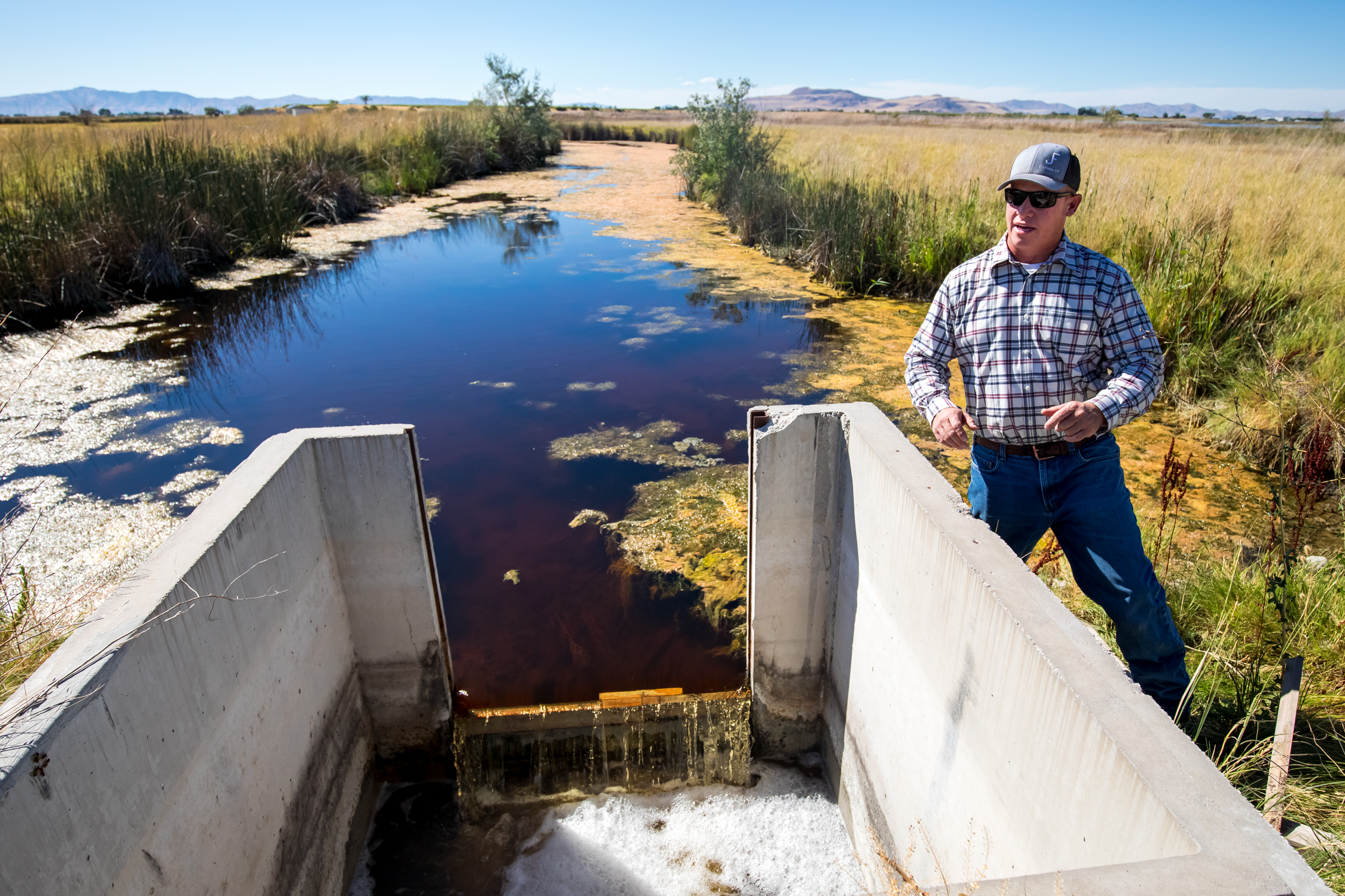 Joel Ferry, director of the Utah Department of Natural Resources, stands near a culvert on his farm property in Brigham City on Aug. 20.