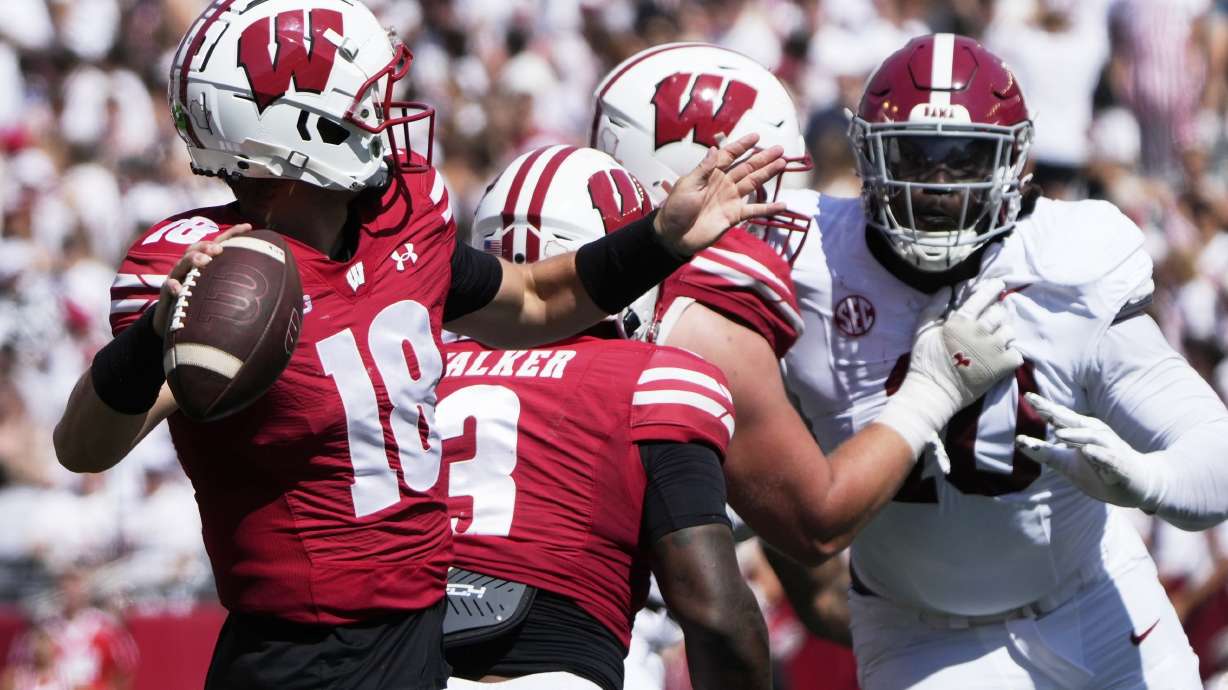 Wisconsin's Braedyn Locke (18) thorws during the first half of an NCAA college football game against Alabama Saturday, Sept. 14, 2024, in Madison, Wis.