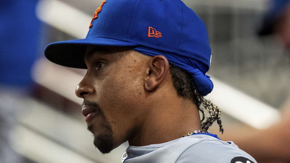 New York Mets shortstop Francisco Lindor sits in the dugout during the third inning of a baseball game against the Atlanta Braves, Tuesday, Sept. 24, 2024, in Atlanta.
