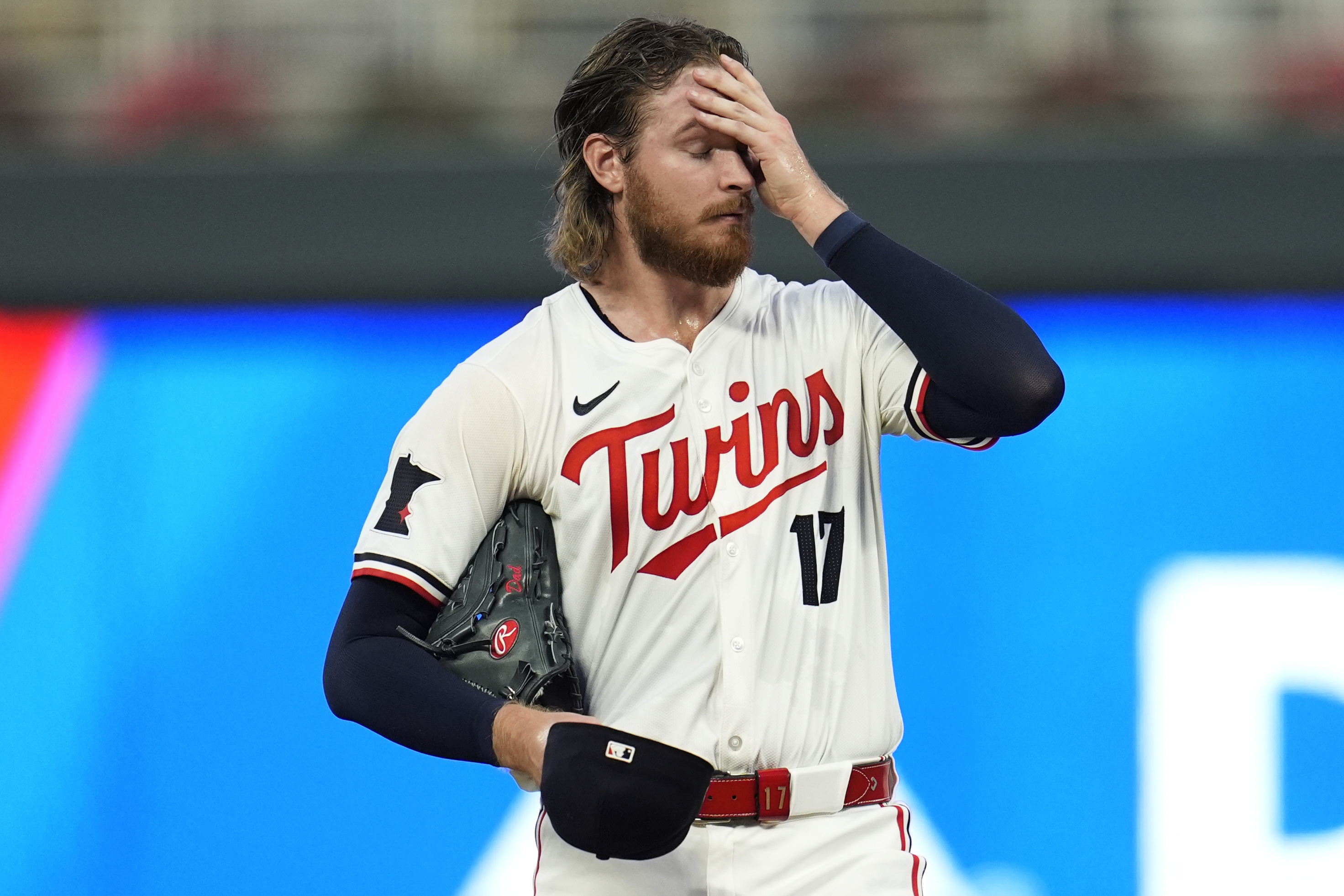 Minnesota Twins starting pitcher Bailey Ober (17) reacts as pitching coach Pete Maki comes to the mound during the first inning of a baseball game against the Miami Marlins, Tuesday, Sept. 24, 2024, in Minneapolis. 