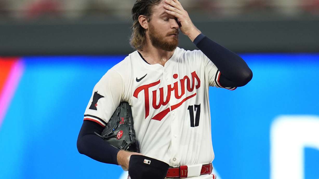 Minnesota Twins starting pitcher Bailey Ober (17) reacts as pitching coach Pete Maki comes to the mound during the first inning of a baseball game against the Miami Marlins, Tuesday, Sept. 24, 2024, in Minneapolis.
