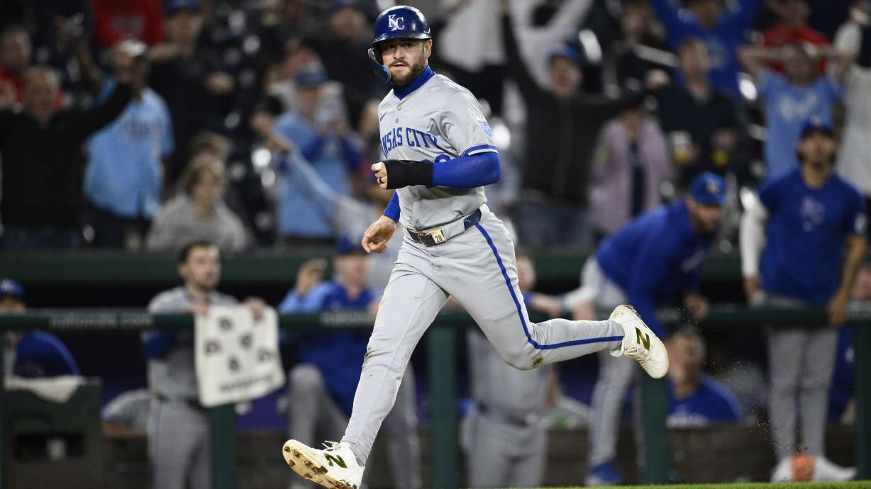 Kansas City Royals' Kyle Isbel runs towards home to score on a throwing error by Washington Nationals shortstop Nasim Nunez during the 10th inning of a baseball game, Tuesday, Sept. 24, 2024, in Washington.