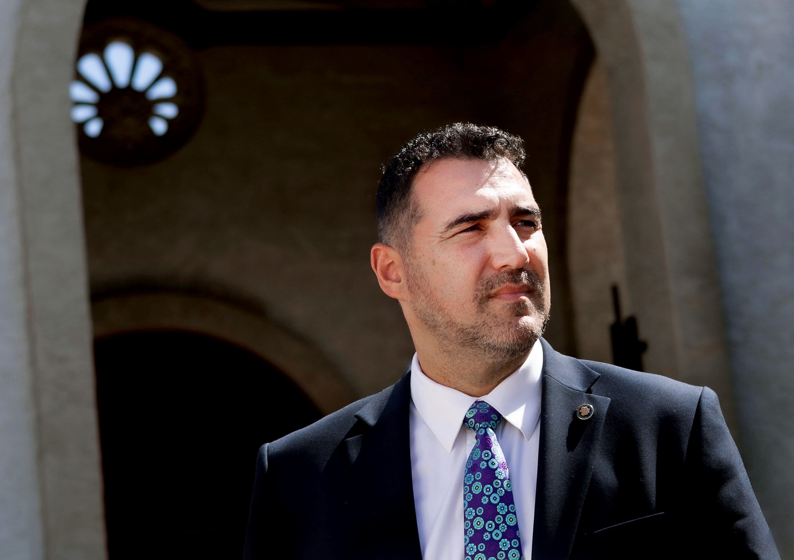 Yasser Sanchez, an immigration attorney is pictured outside his office in Mesa, Ariz., on Aug. 8. In November, Arizonans will once again vote on a strict immigration ballot measure, if passed, would make illegally crossing the border a state crime.