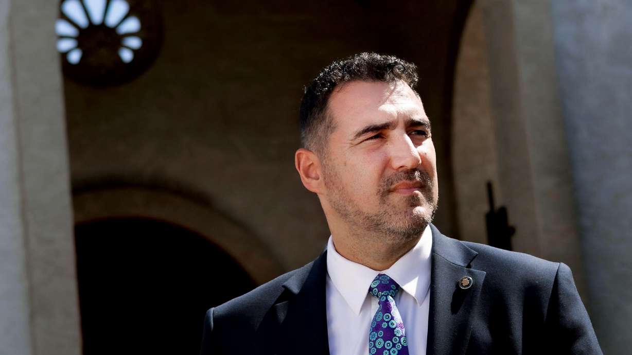 Yasser Sanchez, an immigration attorney is pictured outside his office in Mesa, Ariz., on Aug. 8. In November, Arizonans will once again vote on a strict immigration ballot measure, if passed, would make illegally crossing the border a state crime.